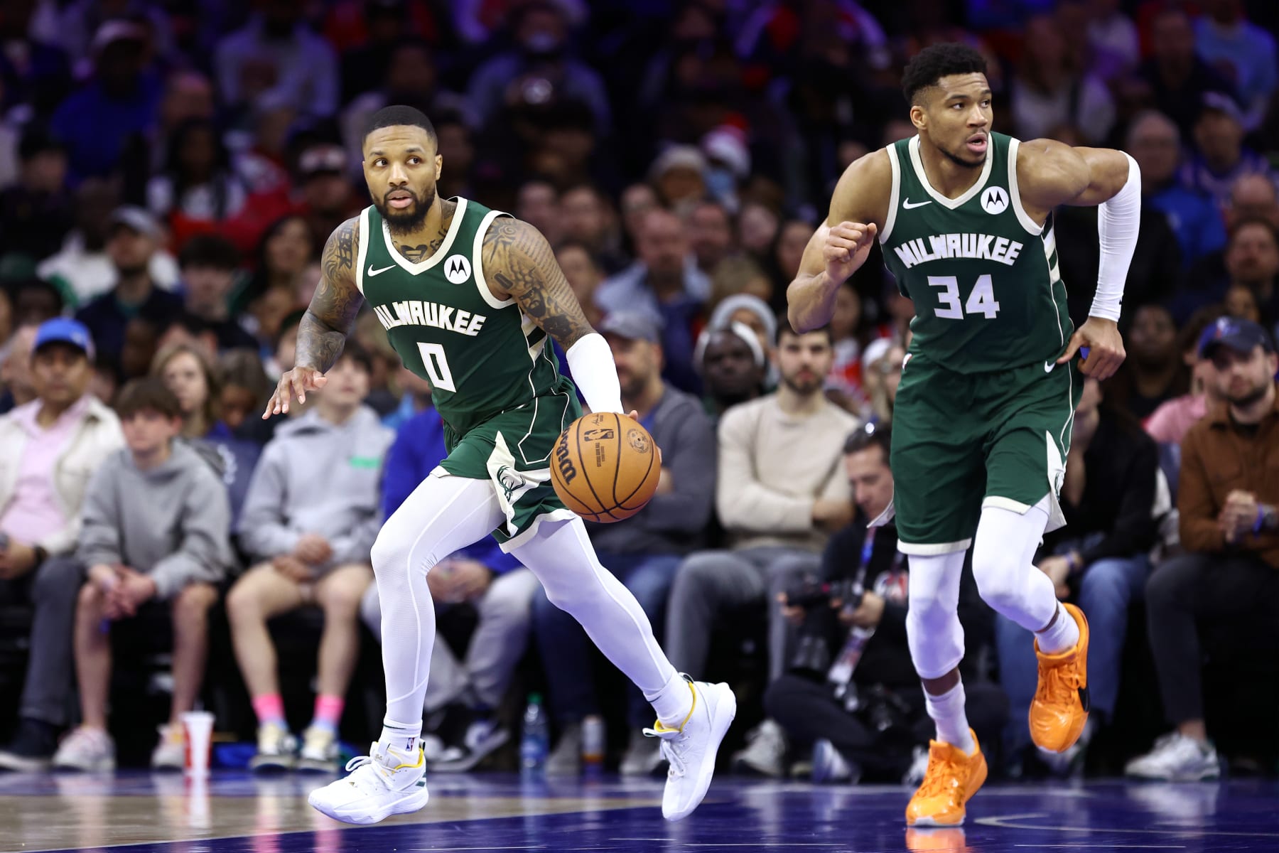 PHILADELPHIA, PENNSYLVANIA - FEBRUARY 25: Damian Lillard #0 of the Milwaukee Bucks dribbles during the third quarter against the Philadelphia 76ers at the Wells Fargo Center on February 25, 2024 in Philadelphia, Pennsylvania. (Photo by Tim Nwachukwu/Getty Images)