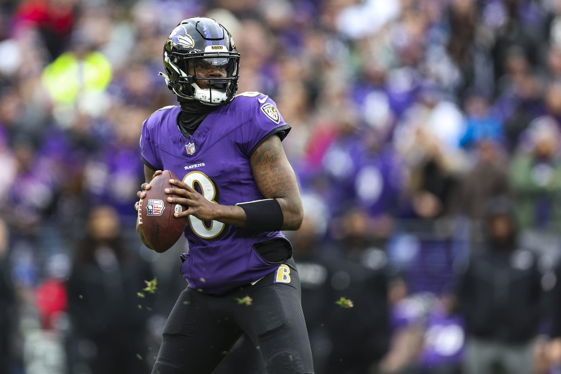 BALTIMORE, MD - JANUARY 28: Lamar Jackson #8 of the Baltimore Ravens drops back to pass during the AFC Championship NFL football game against the Kansas City Chiefs at M&T Bank Stadium on January 28, 2024 in Baltimore, Maryland. (Photo by Perry Knotts/Getty Images)
