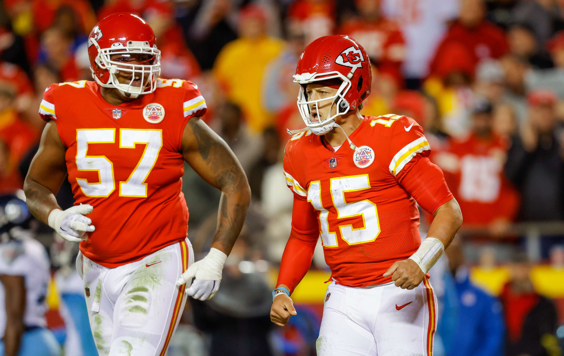 KANSAS CITY, MO - NOVEMBER 06: Patrick Mahomes #15 of the Kansas City Chiefs and Orlando Brown Jr. #57 of the Kansas City Chiefs run off the field after a two-point conversion play in the fourth quarter against the Tennessee Titans at Arrowhead Stadium on November 6, 2022 in Kansas City, Missouri. (Photo by David Eulitt/Getty Images)