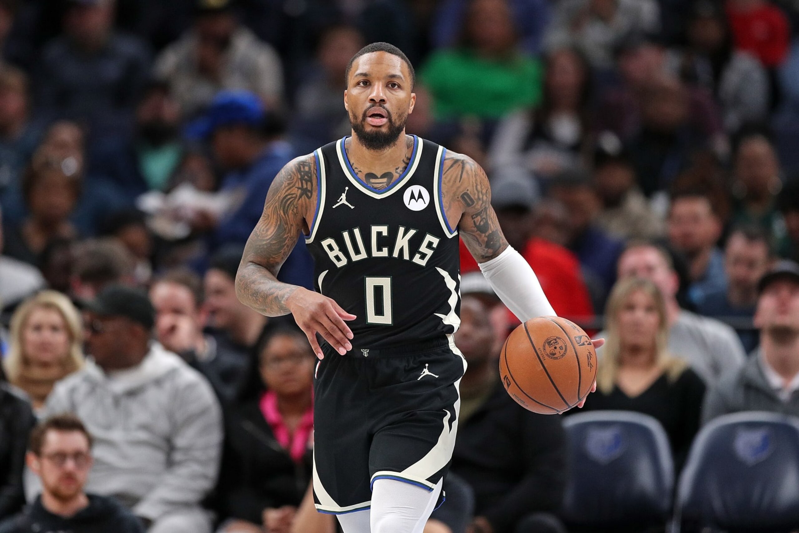 MEMPHIS, TENNESSEE - FEBRUARY 15: Damian Lillard #0 of the Milwaukee Bucks brings the ball up court during the game against the Memphis Grizzlies at FedExForum on February 15, 2024 in Memphis, Tennessee. NOTE TO USER: User expressly acknowledges and agrees that, by downloading and or using this photograph, User is consenting to the terms and conditions of the Getty Images License Agreement. (Photo by Justin Ford/Getty Images)