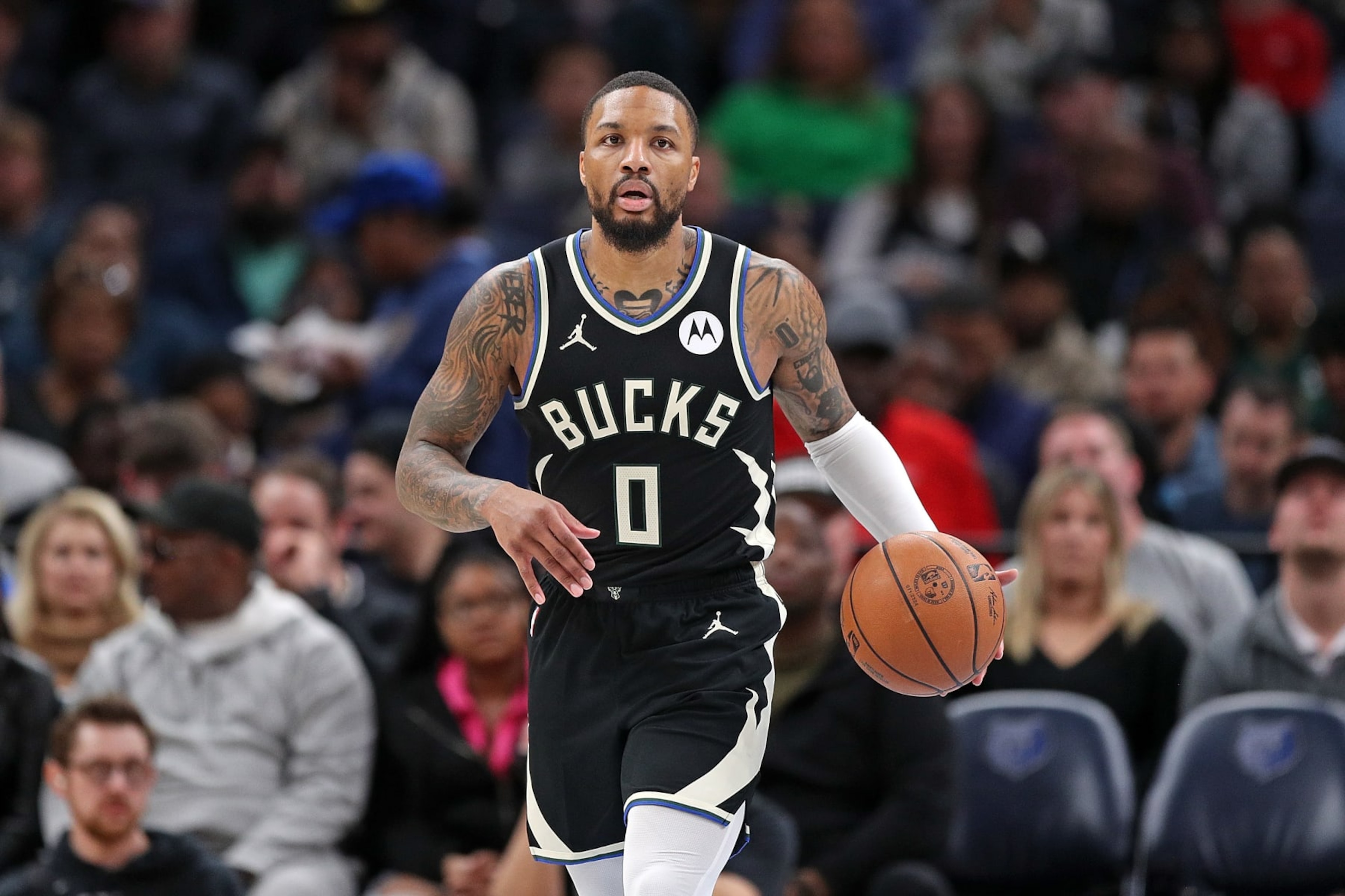 MEMPHIS, TENNESSEE - FEBRUARY 15: Damian Lillard #0 of the Milwaukee Bucks brings the ball up court during the game against the Memphis Grizzlies at FedExForum on February 15, 2024 in Memphis, Tennessee. NOTE TO USER: User expressly acknowledges and agrees that, by downloading and or using this photograph, User is consenting to the terms and conditions of the Getty Images License Agreement. (Photo by Justin Ford/Getty Images)