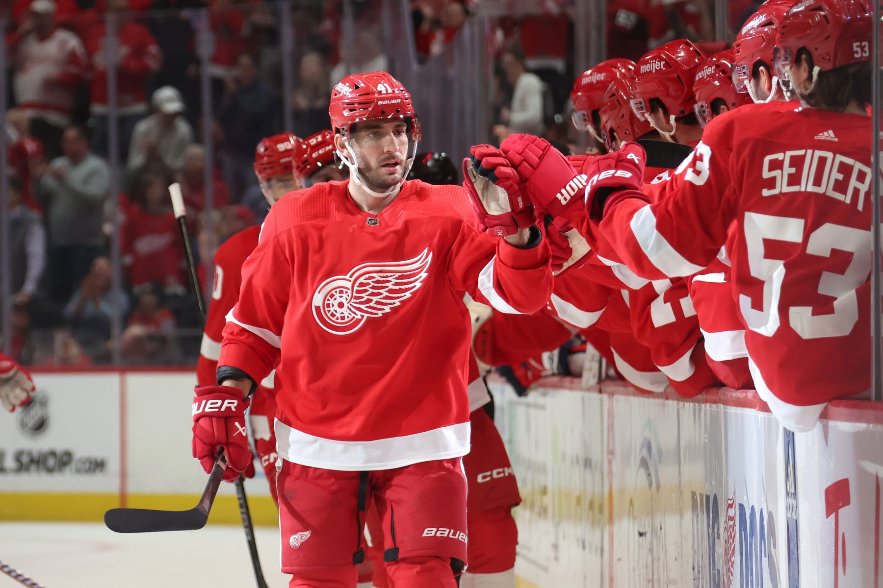 DETROIT, MICHIGAN - FEBRUARY 27: Shayne Gostisbehere #41 of the Detroit Red Wings celebrates his first period goal with teammates while playing the Washington Capitals at Little Caesars Arena on February 27, 2024 in Detroit, Michigan. (Photo by Gregory Shamus/Getty Images)
