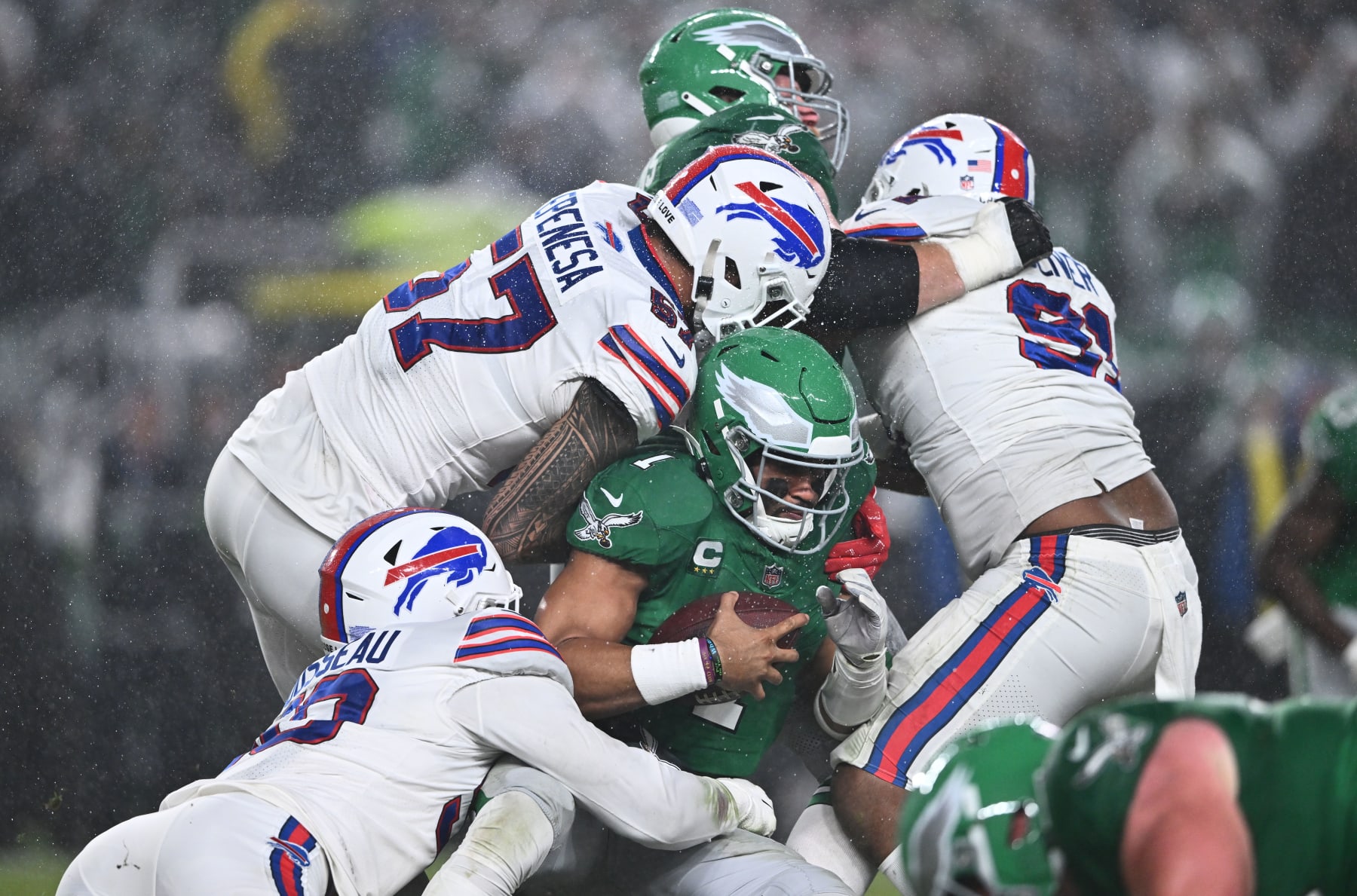 PHILADELPHIA, PA - NOVEMBER 26: Buffalo Bills Defensive End A.J. Epenesa (57) and Defensive End Greg Rousseau (50) tackle Philadelphia Eagles Quarterback Jalen Hurts (1) in the first half during the game between the Buffalo Bills and Philadelphia Eagles on November 26, 2023 at Lincoln Financial Field in Philadelphia, PA. (Photo by Kyle Ross/Icon Sportswire via Getty Images)