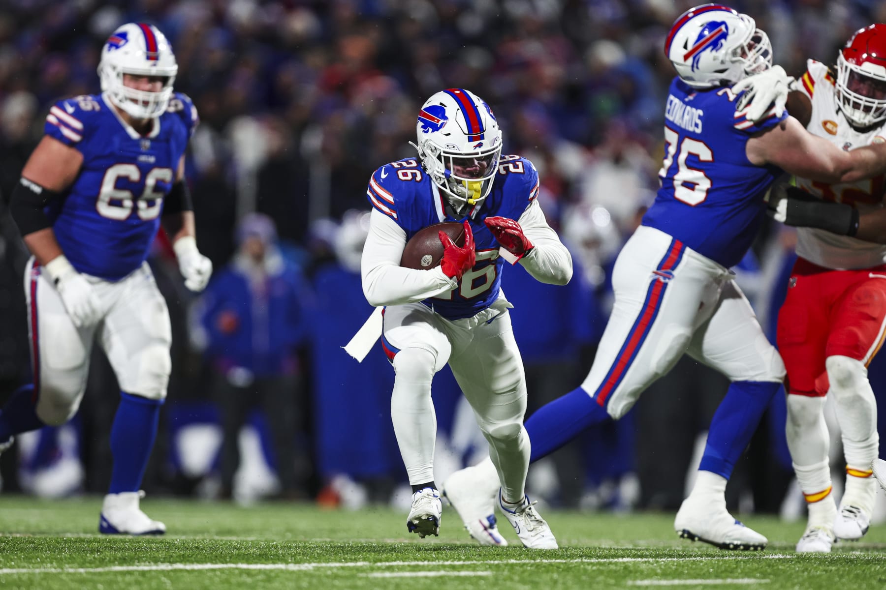ORCHARD PARK, NY - JANUARY 21: Ty Johnson #26 of the Buffalo Bills runs the ball during an NFL divisional round playoff football game against the Kansas City Chiefs at Highmark Stadium on January 21, 2024 in Orchard Park, New York. (Photo by Perry Knotts/Getty Images)
