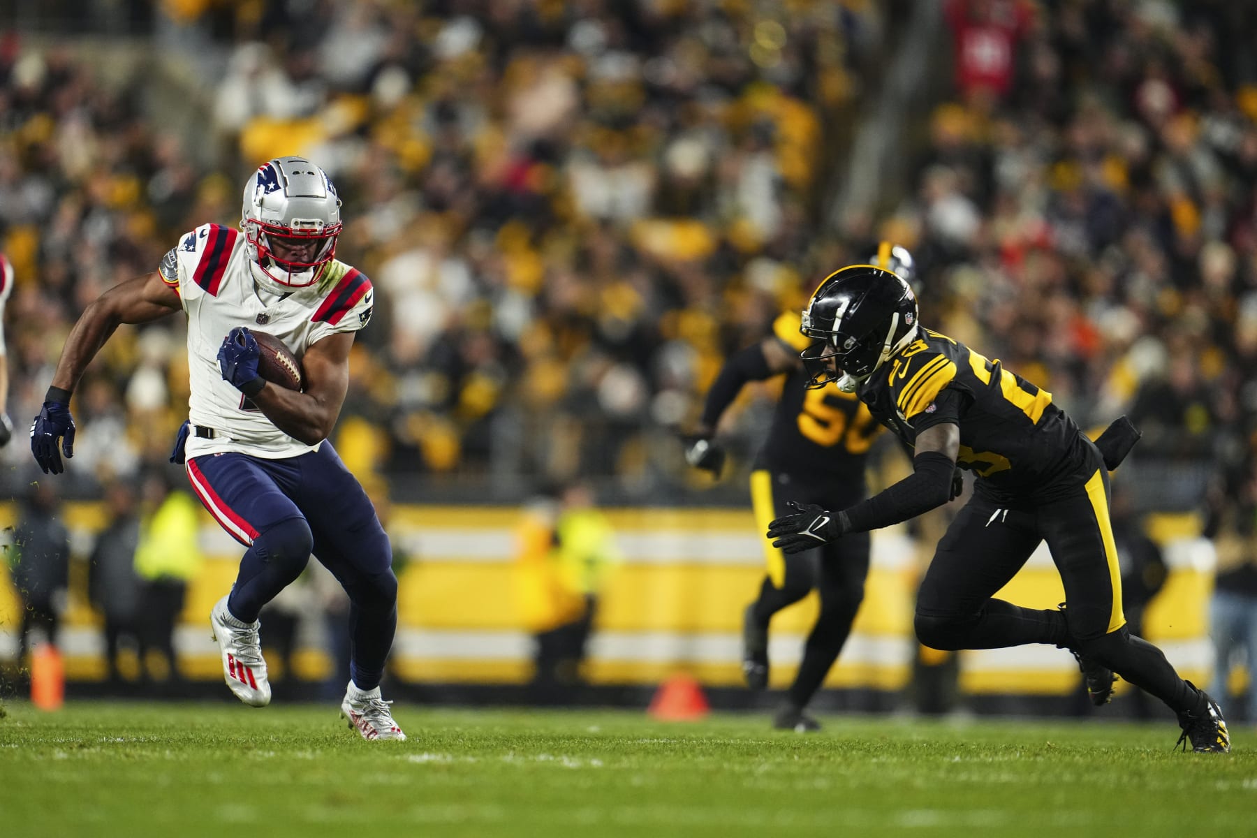 PITTSBURGH, PA - DECEMBER 07: JuJu Smith-Schuster #7 of the New England Patriots runs the ball during an NFL football game against the Pittsburgh Steelers at Acrisure Stadium on December 7, 2023 in Pittsburgh, Pennsylvania. (Photo by Cooper Neill/Getty Images)