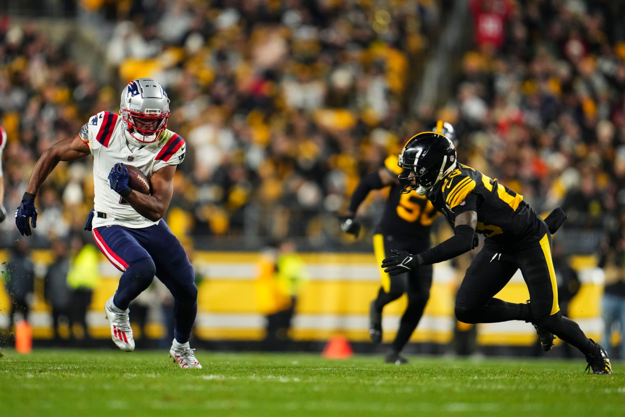 PITTSBURGH, PA - DECEMBER 07: JuJu Smith-Schuster #7 of the New England Patriots runs the ball during an NFL football game against the Pittsburgh Steelers at Acrisure Stadium on December 7, 2023 in Pittsburgh, Pennsylvania. (Photo by Cooper Neill/Getty Images)