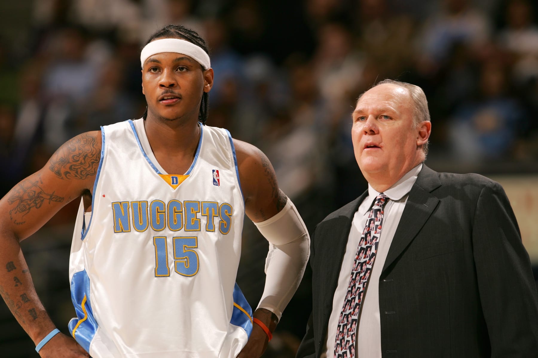 DENVER - DECEMBER 27:  Carmelo Anthony #15 and head coach George Karl of the Denver Nuggets stand during the game against the Philadelphia 76ers on December 27, 2005 at the Pepsi Center in Denver, Colorado.  NOTE TO USER:  User expressly acknowledges and agrees that, by downloading and/or using this photograph, user is consenting to the terms and conditions of the Getty Images License Agreement.  Mandatory Copyright Notice: Copyright 2005 NBAE  (Photo by Garrett W. Ellwood/NBAE via Getty Images)