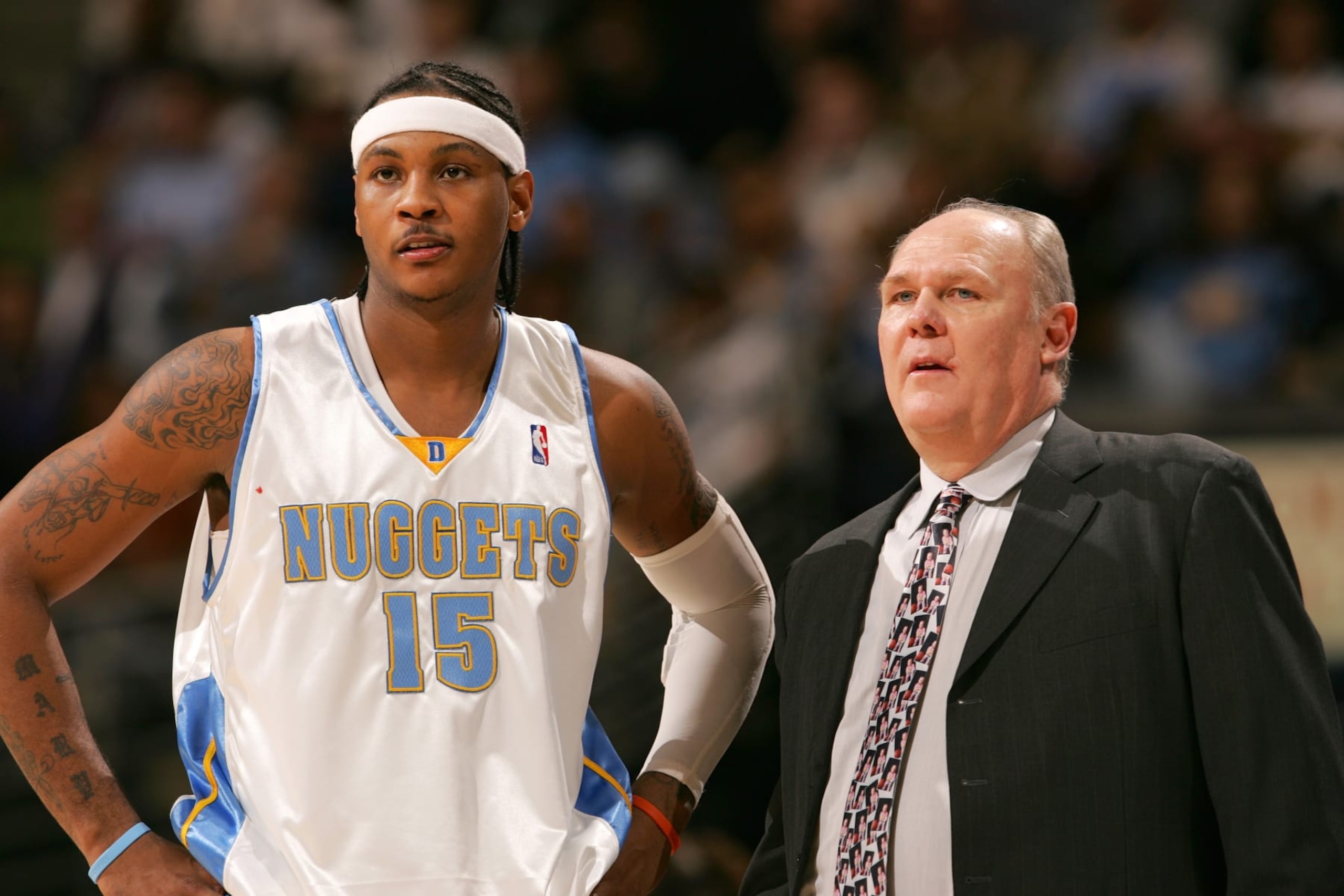 DENVER - DECEMBER 27:  Carmelo Anthony #15 and head coach George Karl of the Denver Nuggets stand during the game against the Philadelphia 76ers on December 27, 2005 at the Pepsi Center in Denver, Colorado.  NOTE TO USER:  User expressly acknowledges and agrees that, by downloading and/or using this photograph, user is consenting to the terms and conditions of the Getty Images License Agreement.  Mandatory Copyright Notice: Copyright 2005 NBAE  (Photo by Garrett W. Ellwood/NBAE via Getty Images)