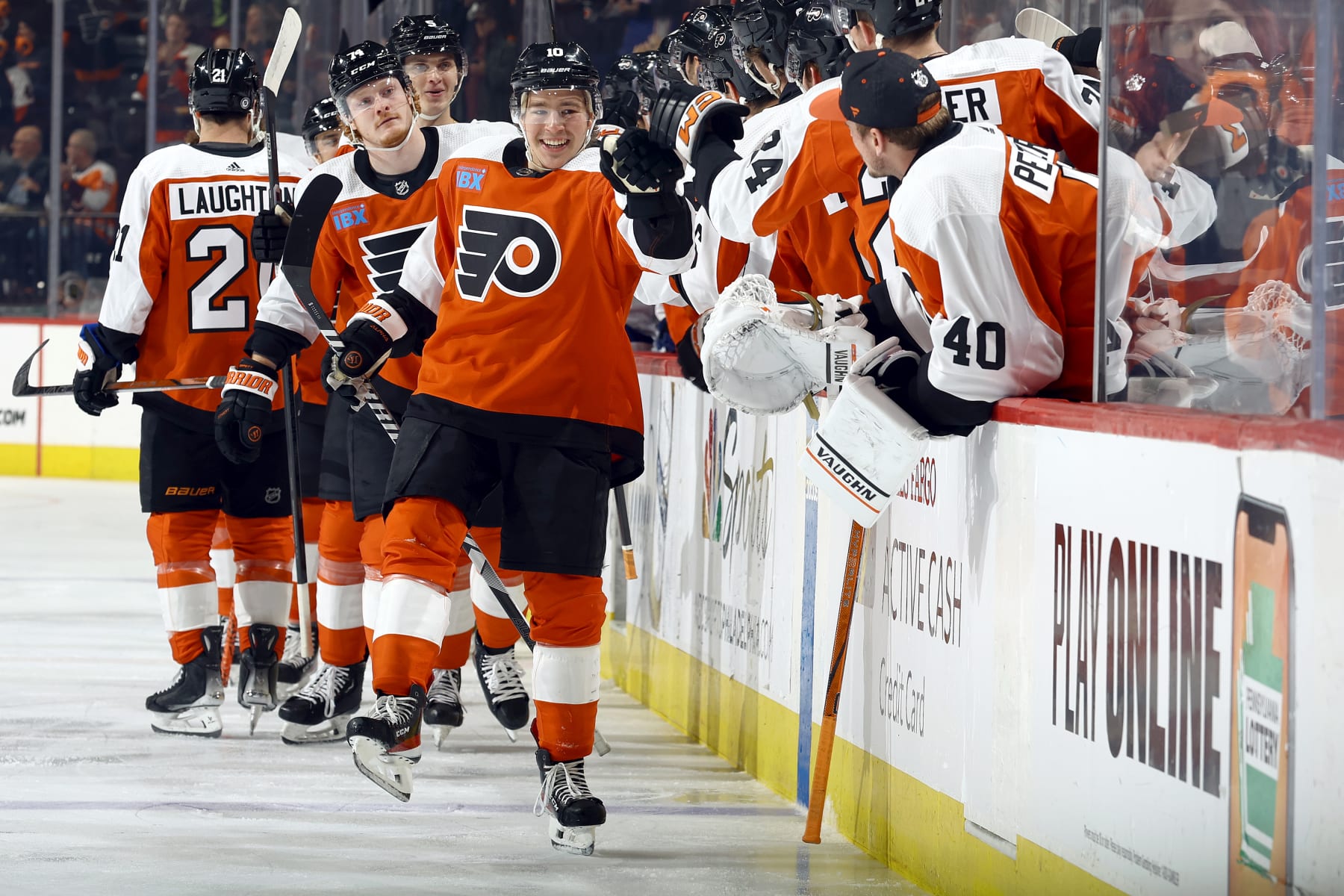 PHILADELPHIA, PENNSYLVANIA - FEBRUARY 27: Bobby Brink #10 of the Philadelphia Flyers reacts with teammates after scoring during the first period against the Tampa Bay Lightning at the Wells Fargo Center on February 27, 2024 in Philadelphia, Pennsylvania. (Photo by Tim Nwachukwu/Getty Images)