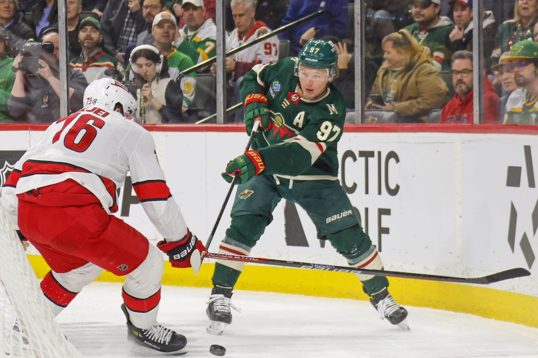 SAINT PAUL, MN - FEBRUARY 27: Brady Skjei #76 of the Carolina Hurricanes defends Kirill Kaprizov #97 of the Minnesota Wild during the game at the Xcel Energy Center on February 27, 2024 in Saint Paul, Minnesota. (Photo by Bruce Kluckhohn/NHLI via Getty Images)
