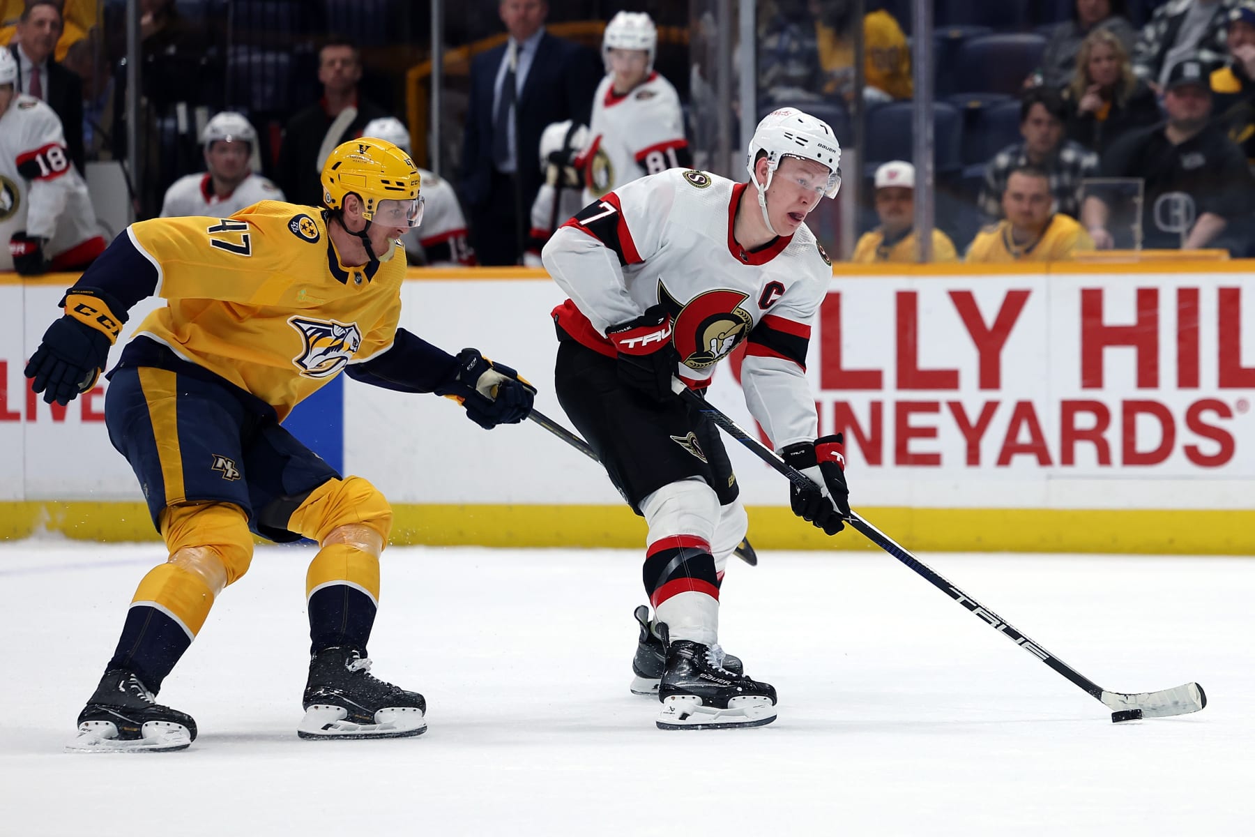 NASHVILLE, TENNESSEE - FEBRUARY 27: Brady Tkachuk #7 of the Ottawa Senators looks to pass against Michael McCarron #47 of the Nashville Predators in the second period at Bridgestone Arena on February 27, 2024 in Nashville, Tennessee. The Nashville Predators won 4-1. (Photo by Donald Page/Getty Images)