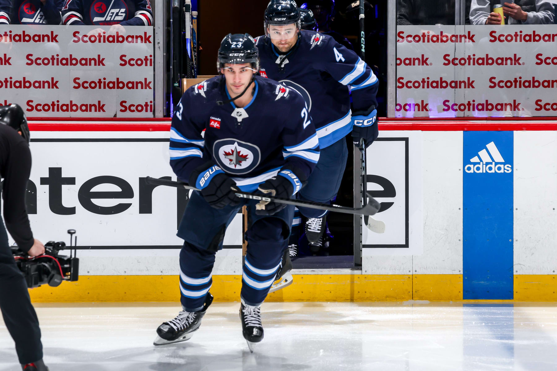 WINNIPEG, CANADA - FEBRUARY 27: Sean Monahan #23 and Neal Pionk #4 of the Winnipeg Jets hit the ice prior to puck drop against the St. Louis Blues at the Canada Life Centre on February 27, 2024 in Winnipeg, Manitoba, Canada. (Photo by Jonathan Kozub/NHLI via Getty Images)