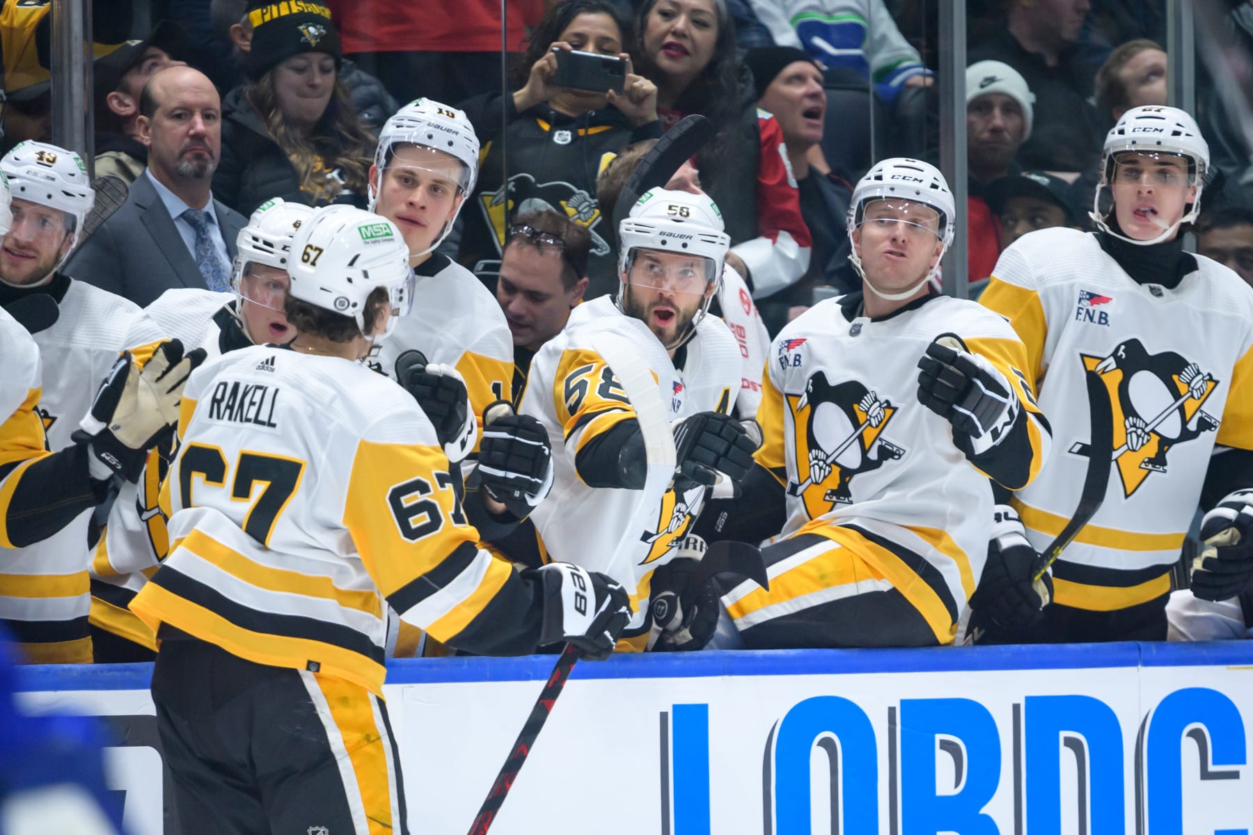 VANCOUVER, CANADA - FEBRUARY 27: Rickard Rakell #67 of the Pittsburgh Penguins celebrates with the bench after scoring a goal against the Vancouver Canucks during the second period  at Rogers Arena on February 27, 2024 in Vancouver, British Columbia, Canada. (Photo by Derek Cain/Getty Images)
