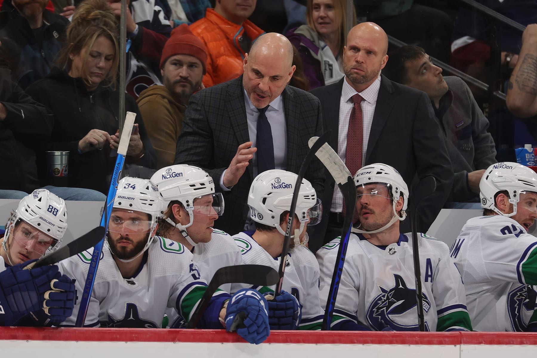 DENVER, COLORADO - FEBRUARY 20: Head coach of the Vancouver Canucks Rick Tocchet speaks to players during the third period against the Colorado Avalanche at Ball Arena on February 20, 2024 in Denver, Colorado. (Photo by Michael Martin/NHLI via Getty Images)