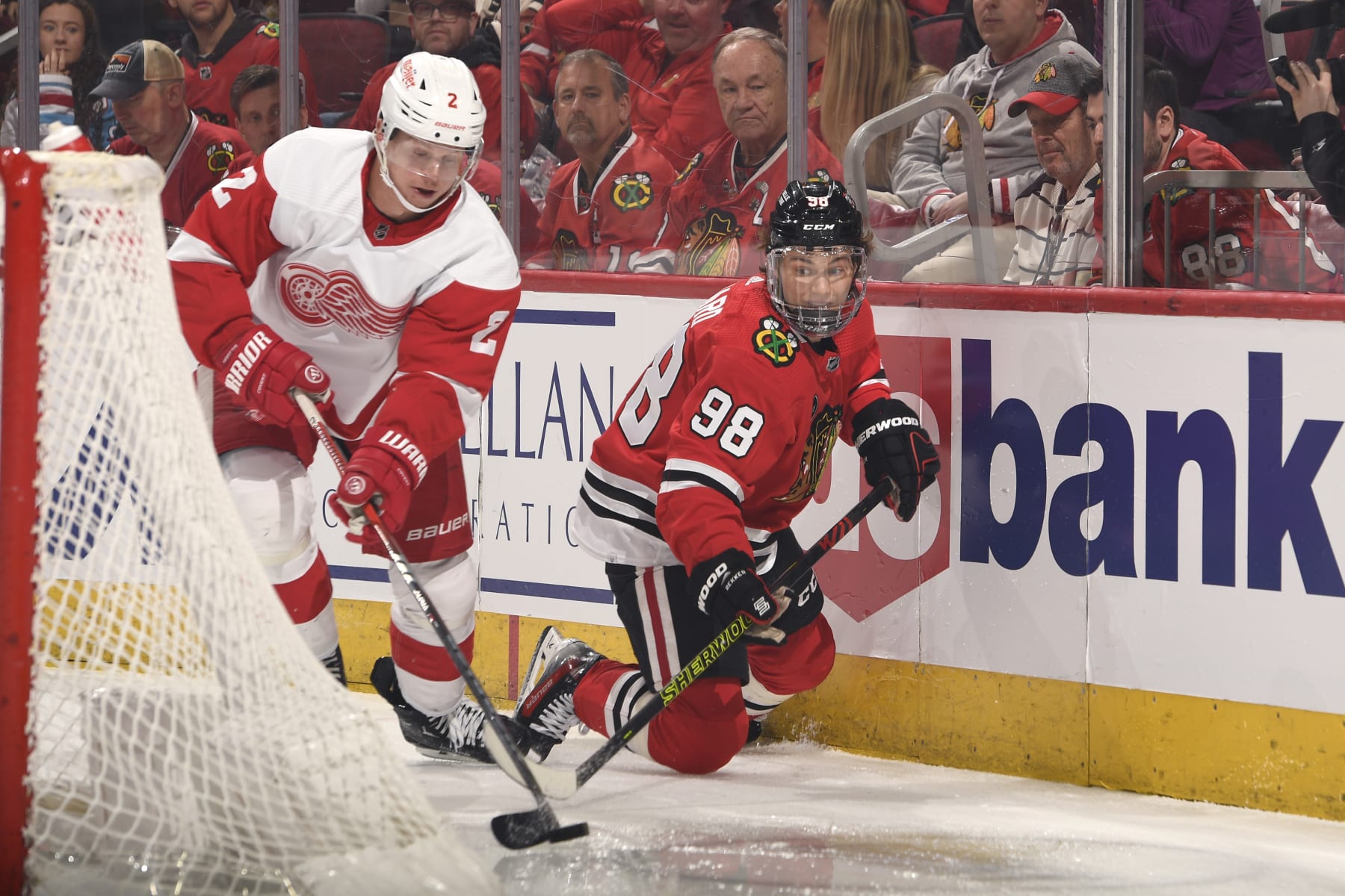 CHICAGO, ILLINOIS - FEBRUARY 25: Connor Bedard #98 of the Chicago Blackhawks and Olli Maatta #2 of the Detroit Red Wings chase the puck in the first period at the United Center on February 25, 2024 in Chicago, Illinois. (Photo by Bill Smith/NHLI via Getty Images)