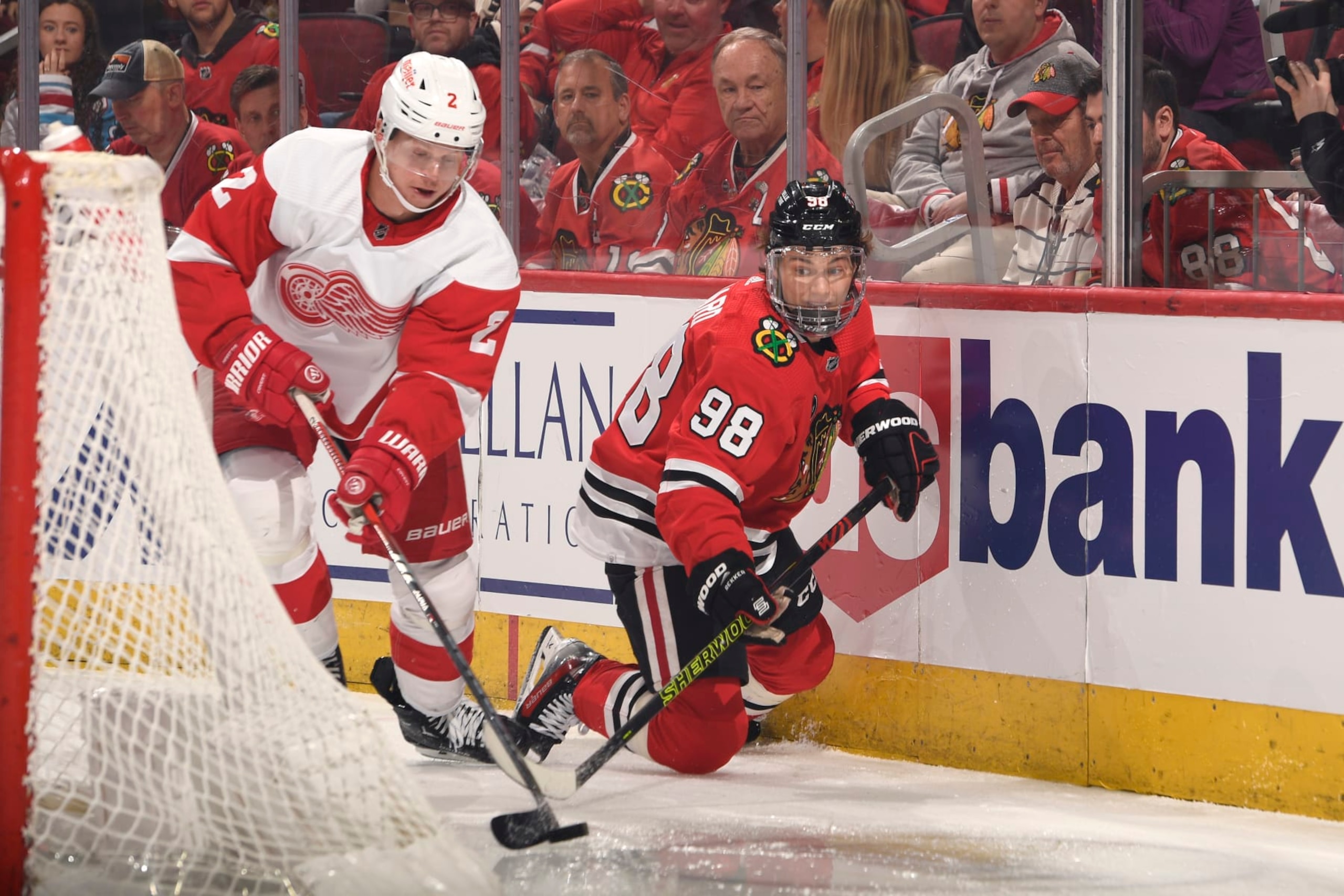 CHICAGO, ILLINOIS - FEBRUARY 25: Connor Bedard #98 of the Chicago Blackhawks and Olli Maatta #2 of the Detroit Red Wings chase the puck in the first period at the United Center on February 25, 2024 in Chicago, Illinois. (Photo by Bill Smith/NHLI via Getty Images)