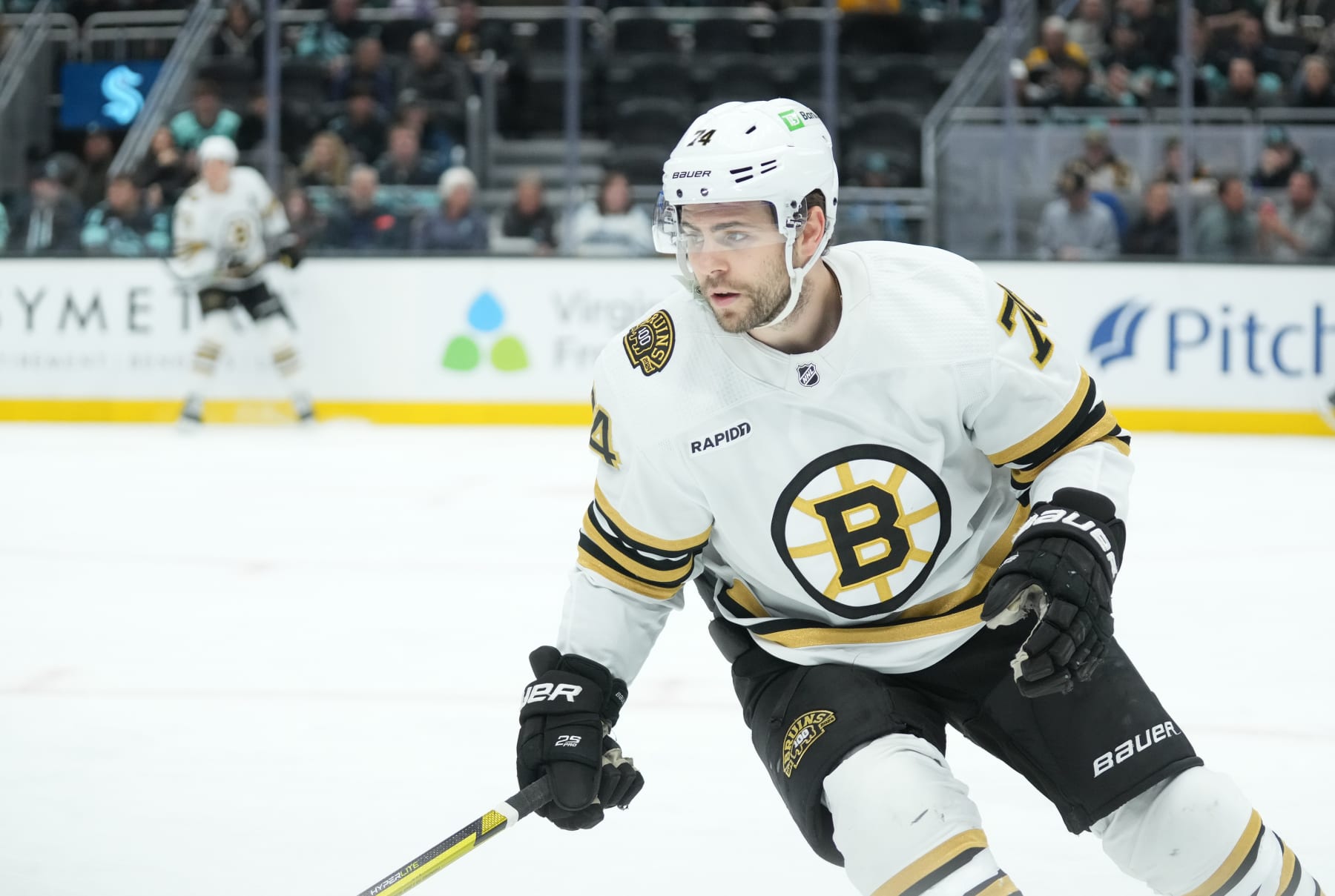 SEATTLE, WA - FEBRUARY 26: Boston Bruins left wing Jake DeBrusk (74) skates in his own end during an NHL game between the Seattle Kraken and the Boston Bruins on February 26, 2024 at Climate Pledge Arena in Seattle, WA. (Photo by Jeff Halstead/Icon Sportswire via Getty Images)