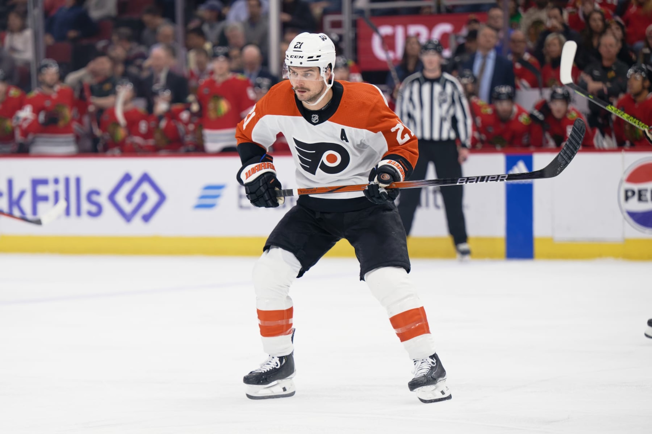 CHICAGO, ILLINOIS - FEBRUARY 21:  Scott Laughton #21 of the Philadelphia Flyers skates against the Chicago Blackhawks on February 21, 2024 at United Center in Chicago, Illinois.  (Photo by Jamie Sabau/Getty Images)