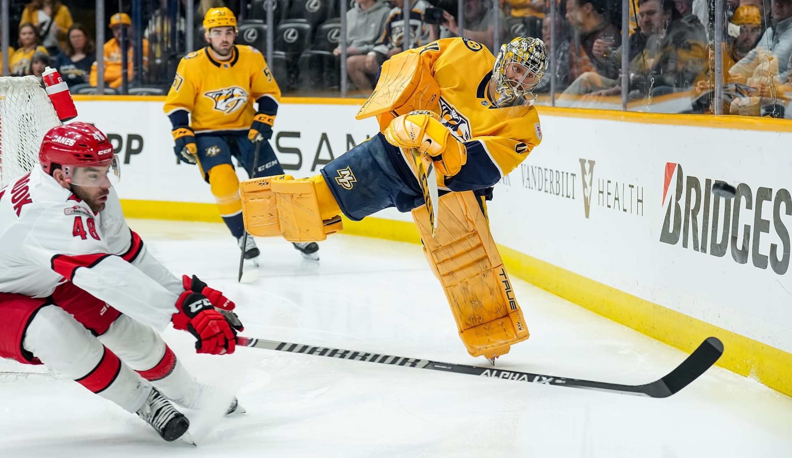 NASHVILLE, TENNESSEE - APRIL 6: Juuse Saros #74 of the Nashville Predators clears the puck against Jordan Martinook #48 of the Carolina Hurricanes during an NHL game at Bridgestone Arena on April 6, 2023 in Nashville, Tennessee. (Photo by John Russell/NHLI via Getty Images) NASHVILLE, TENNESSEE - APRIL 6: Juuse Saros #74 of the Nashville Predators clears the puck against Jordan Martinook #48 of the Carolina Hurricanes during an NHL game at Bridgestone Arena on April 6, 2023 in Nashville, Tennessee. (Photo by John Russell/NHLI via Getty Images)
