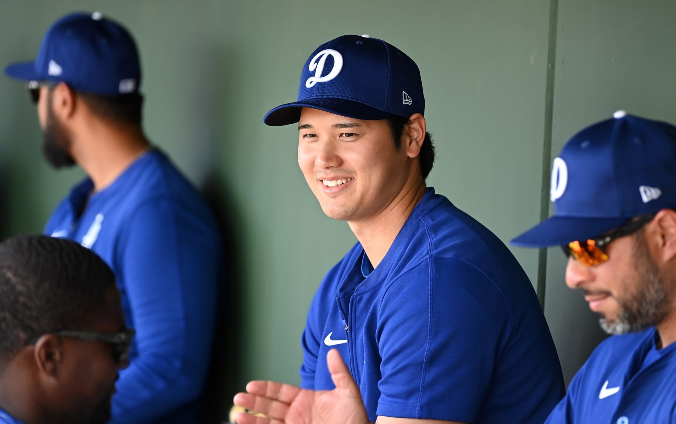 SURPRISE, ARIZONA - FEBRUARY 28: Shohei Ohtani #17 of the Los Angeles Dodgers looks on from the dugout against the Texas Rangers during a spring training game at Surprise Stadium on February 28, 2024 in Surprise, Arizona. (Photo by Norm Hall/Getty Images)