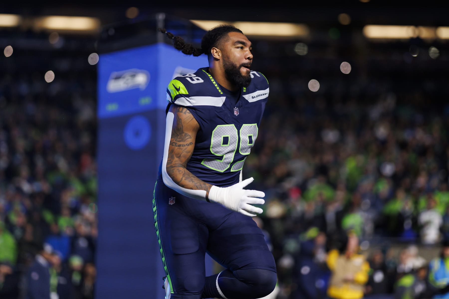 SEATTLE, WASHINGTON - DECEMBER 18: Leonard Williams #99 of the Seattle Seahawks runs onto the field during player introductions before an NFL football game against the Philadelphia Eagles at Lumen Field on December 18, 2023 in Seattle, Washington. (Photo by Ryan Kang/Getty Images)