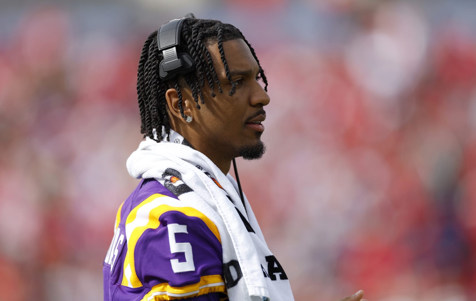 TAMPA, FLORIDA - JANUARY 01: Jayden Daniels #5 of the LSU Tigers looks on during the ReliaQuest Bowl against the Wisconsin Badgers at Raymond James Stadium on January 01, 2024 in Tampa, Florida. (Photo by Mike Ehrmann/Getty Images)