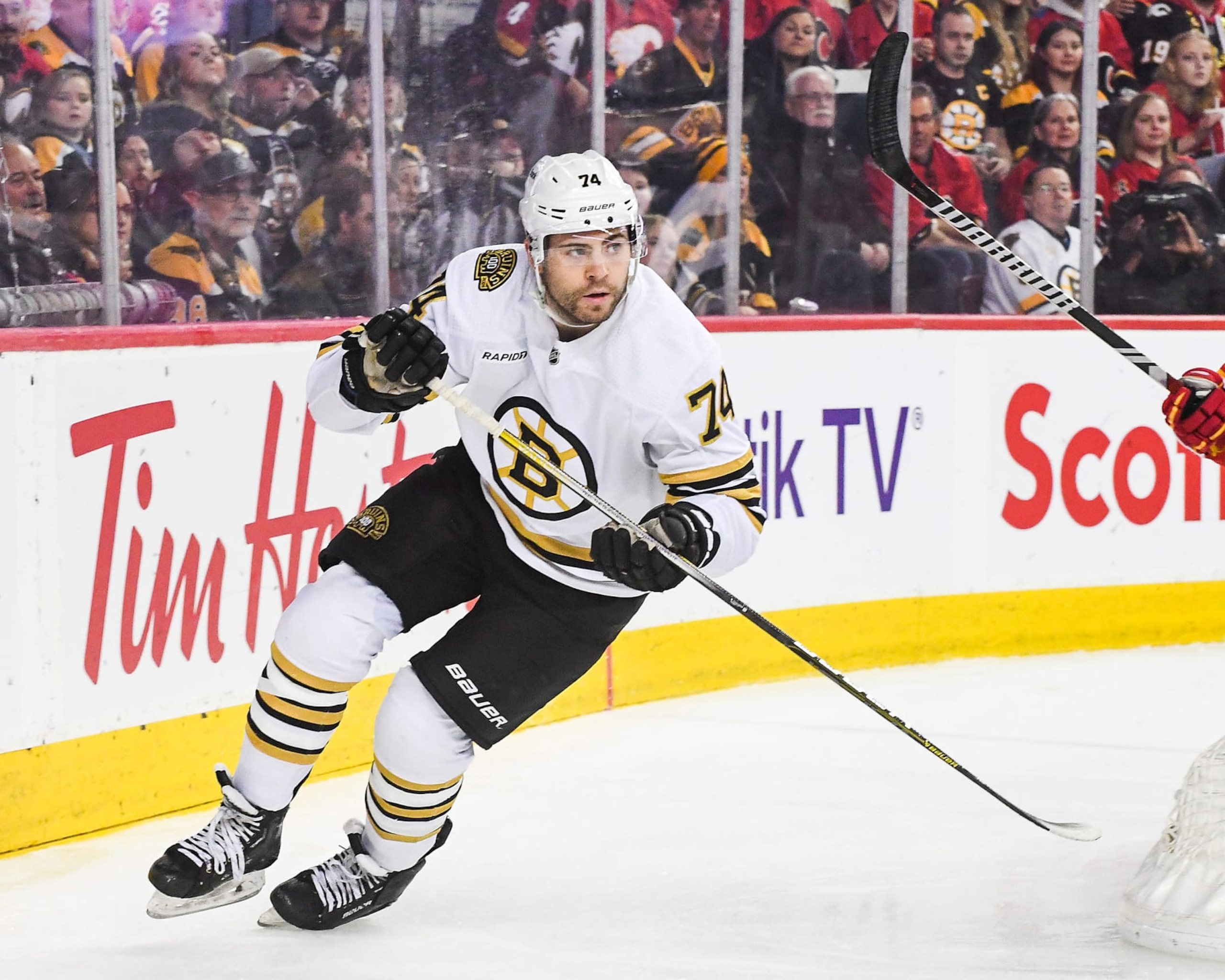 CALGARY, CANADA - FEBRUARY 22: Jake DeBrusk #74 of the Boston Bruins in action against the Calgary Flames during an NHL game at Scotiabank Saddledome on February 22, 2024 in Calgary, Alberta, Canada.  (Photo by Derek Leung/Getty Images)