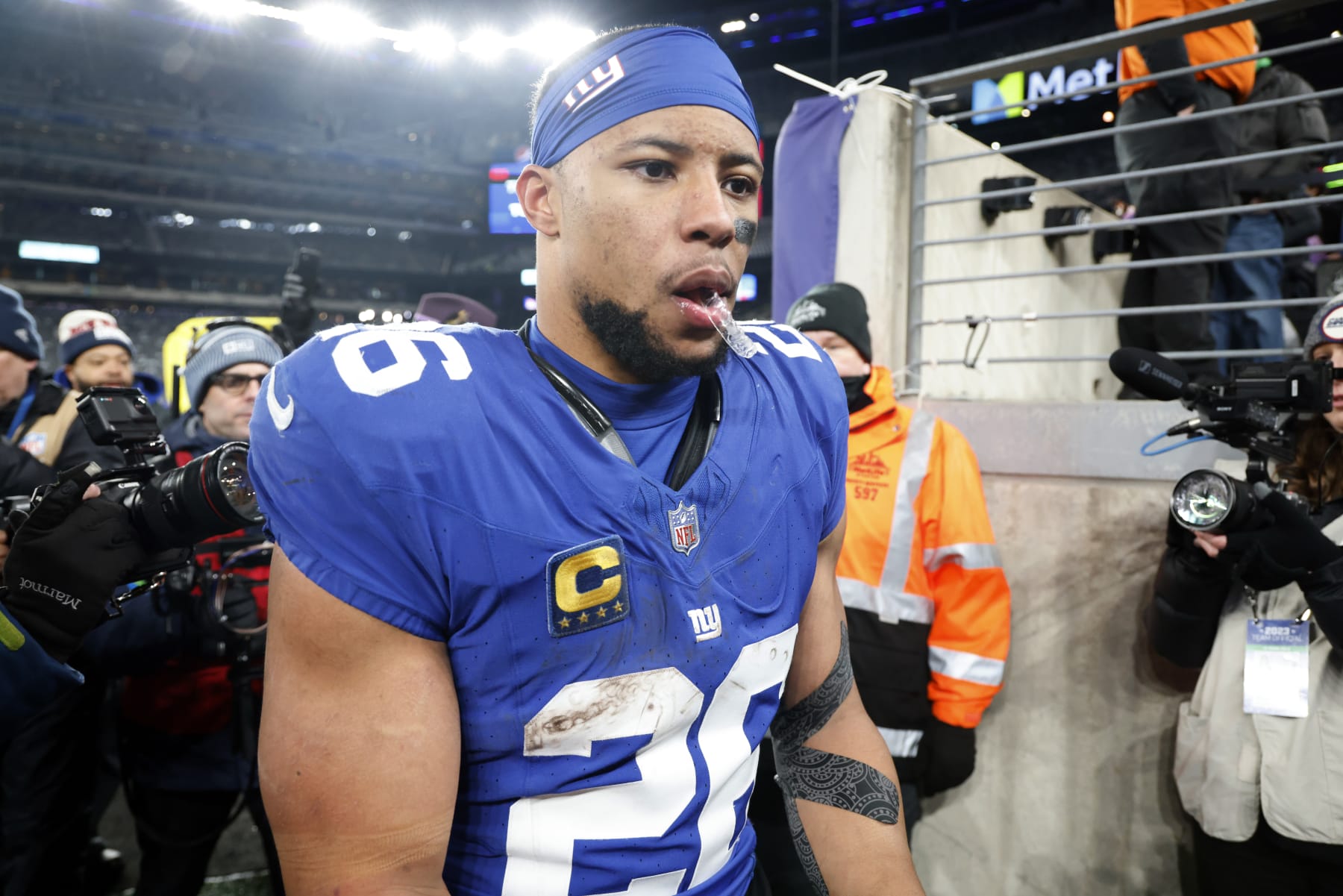 EAST RUTHERFORD, NEW JERSEY - JANUARY 07: Saquon Barkley #26 of the New York Giants walks off the field after a win over the Philadelphia Eagles at MetLife Stadium on January 07, 2024 in East Rutherford, New Jersey. (Photo by Al Bello/Getty Images)