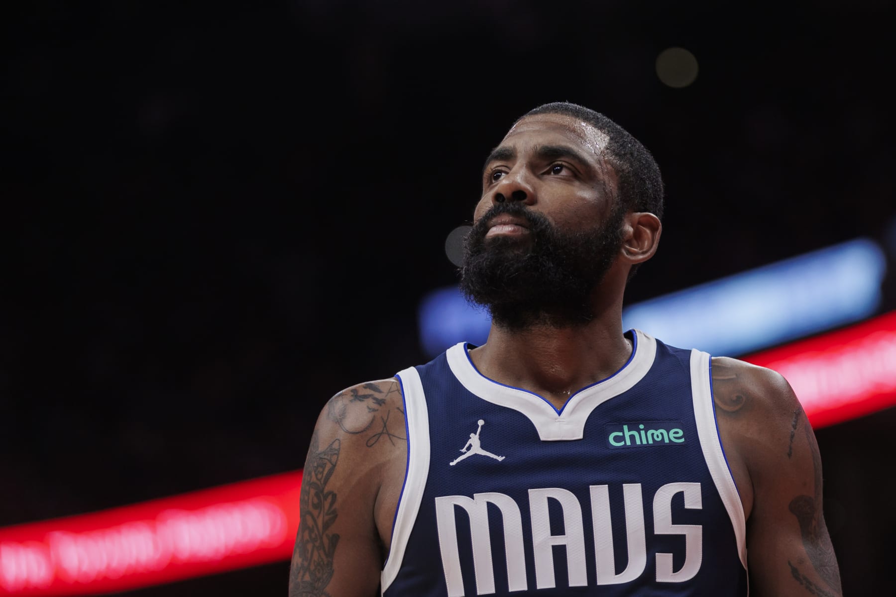 TORONTO, CANADA - FEBRUARY 28: Kyrie Irving #11 of the Dallas Mavericks looks up during a break in play against the Toronto Raptors in the second half of their NBA game at Scotiabank Arena on February 28, 2024 in Toronto, Canada. NOTE TO USER: User expressly acknowledges and agrees that, by downloading and or using this photograph, User is consenting to the terms and conditions of the Getty Images License Agreement. (Photo by Cole Burston/Getty Images)