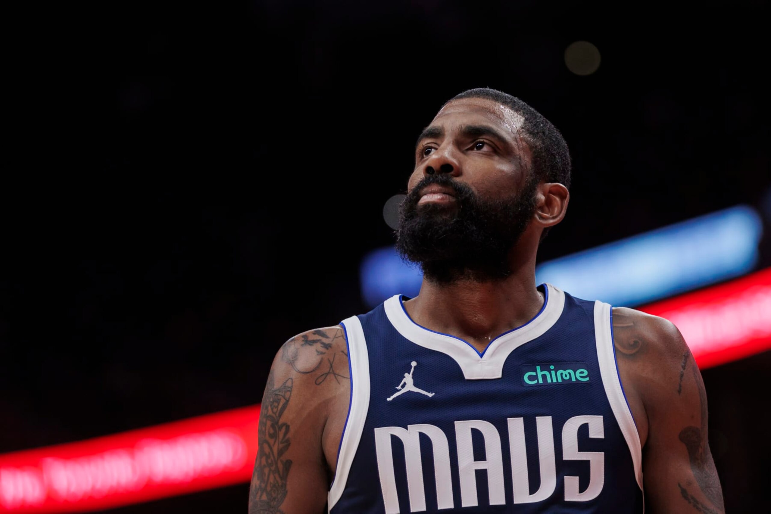 TORONTO, CANADA - FEBRUARY 28: Kyrie Irving #11 of the Dallas Mavericks looks up during a break in play against the Toronto Raptors in the second half of their NBA game at Scotiabank Arena on February 28, 2024 in Toronto, Canada. NOTE TO USER: User expressly acknowledges and agrees that, by downloading and or using this photograph, User is consenting to the terms and conditions of the Getty Images License Agreement. (Photo by Cole Burston/Getty Images)