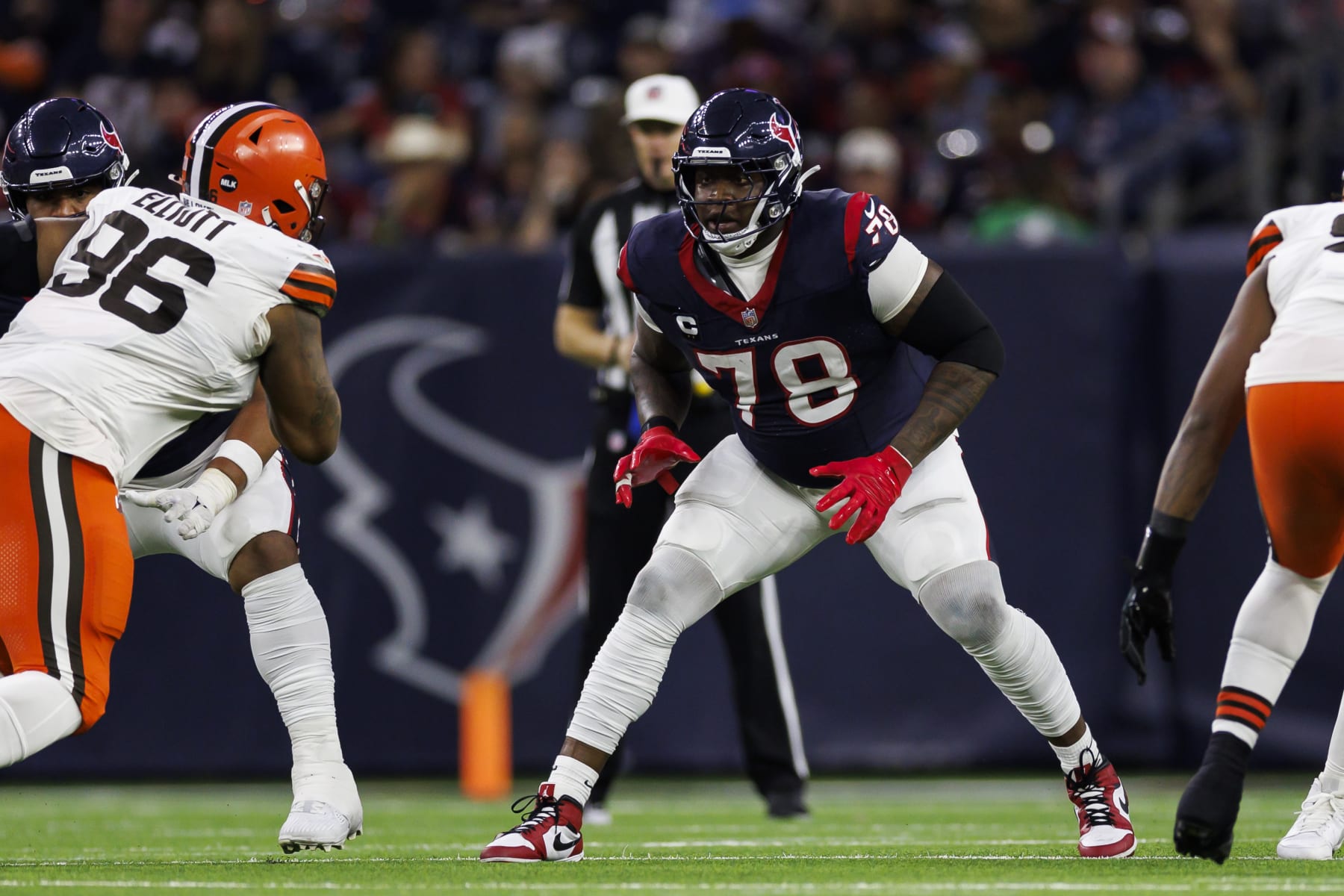 HOUSTON, TEXAS - JANUARY 13: Laremy Tunsil #78 of the Houston Texans blocks during an AFC wild-card playoff football game against the Cleveland Browns at NRG Stadium on January 13, 2024 in Houston, Texas. (Photo by Ryan Kang/Getty Images)