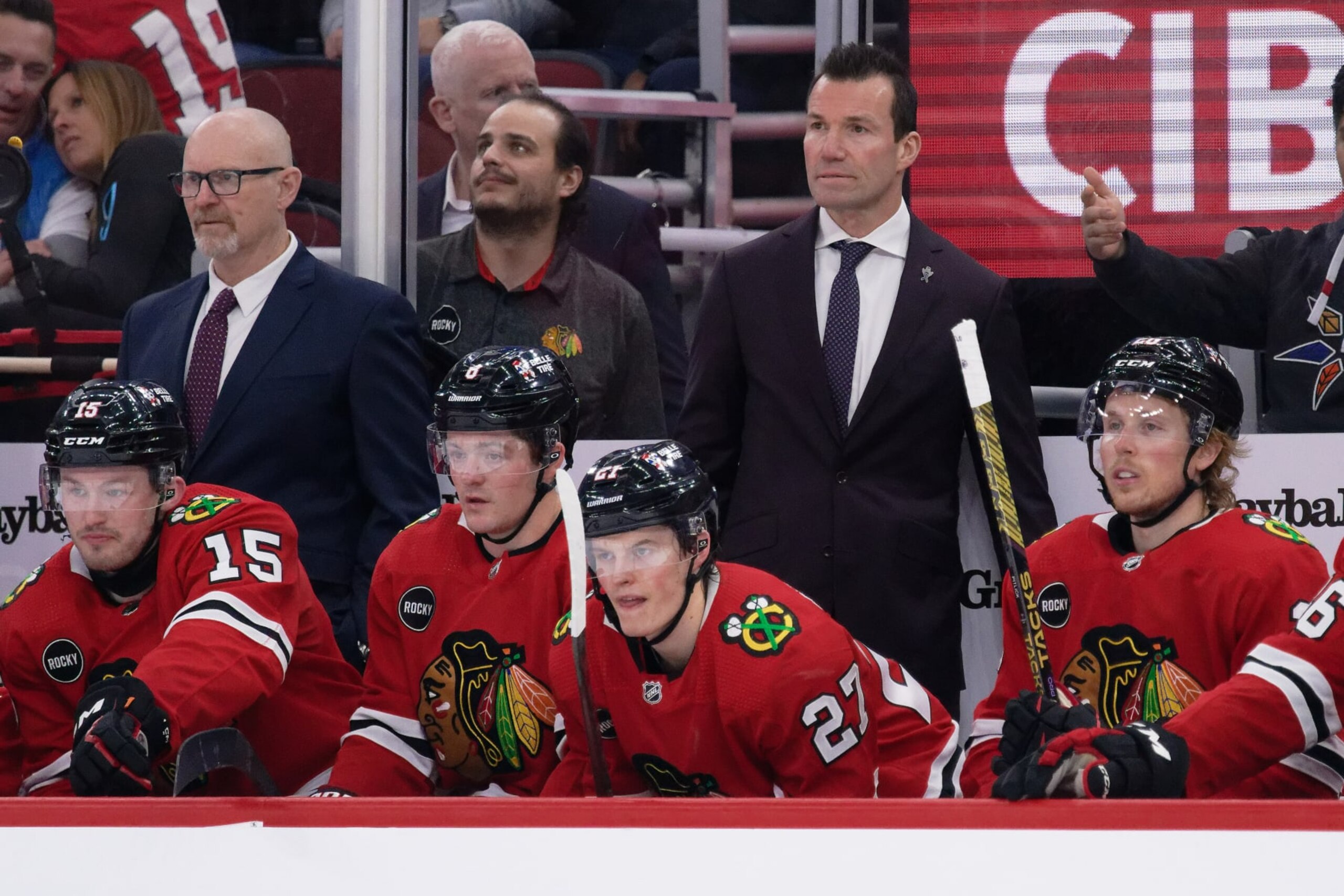 CHICAGO, ILLINOIS - FEBRUARY 09:  Assistant Coach Derek King, left, and Head Coach Luke Richardson of the Chicago Blackhawks watch their team play against the New York Rangers on February 09, 2024 at United Center in Chicago, Illinois.  (Photo by Jamie Sabau/Getty Images)