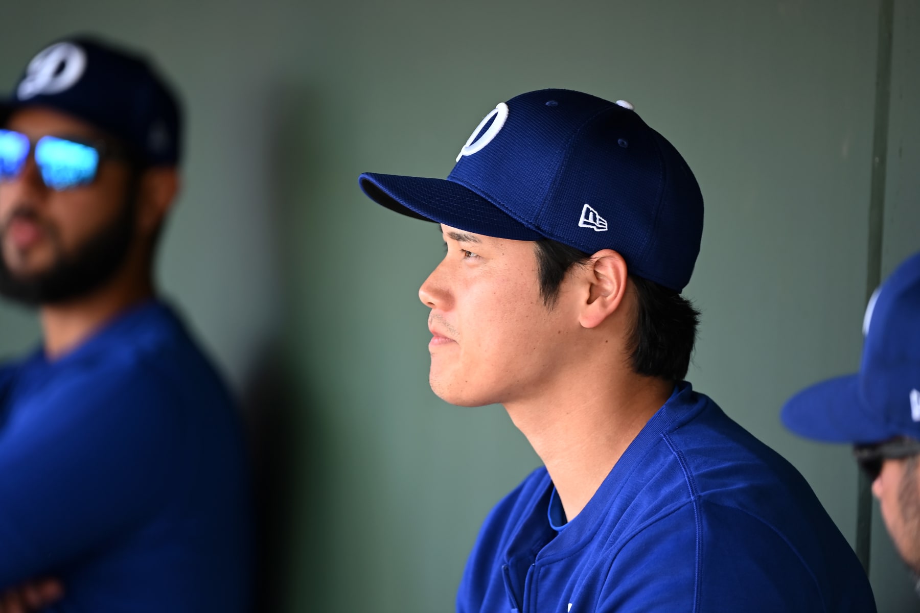 SURPRISE, ARIZONA - FEBRUARY 28: Shohei Ohtani #17 of the Los Angeles Dodgers looks on from the dugout against the Texas Rangers during a spring training game at Surprise Stadium on February 28, 2024 in Surprise, Arizona. (Photo by Norm Hall/Getty Images)