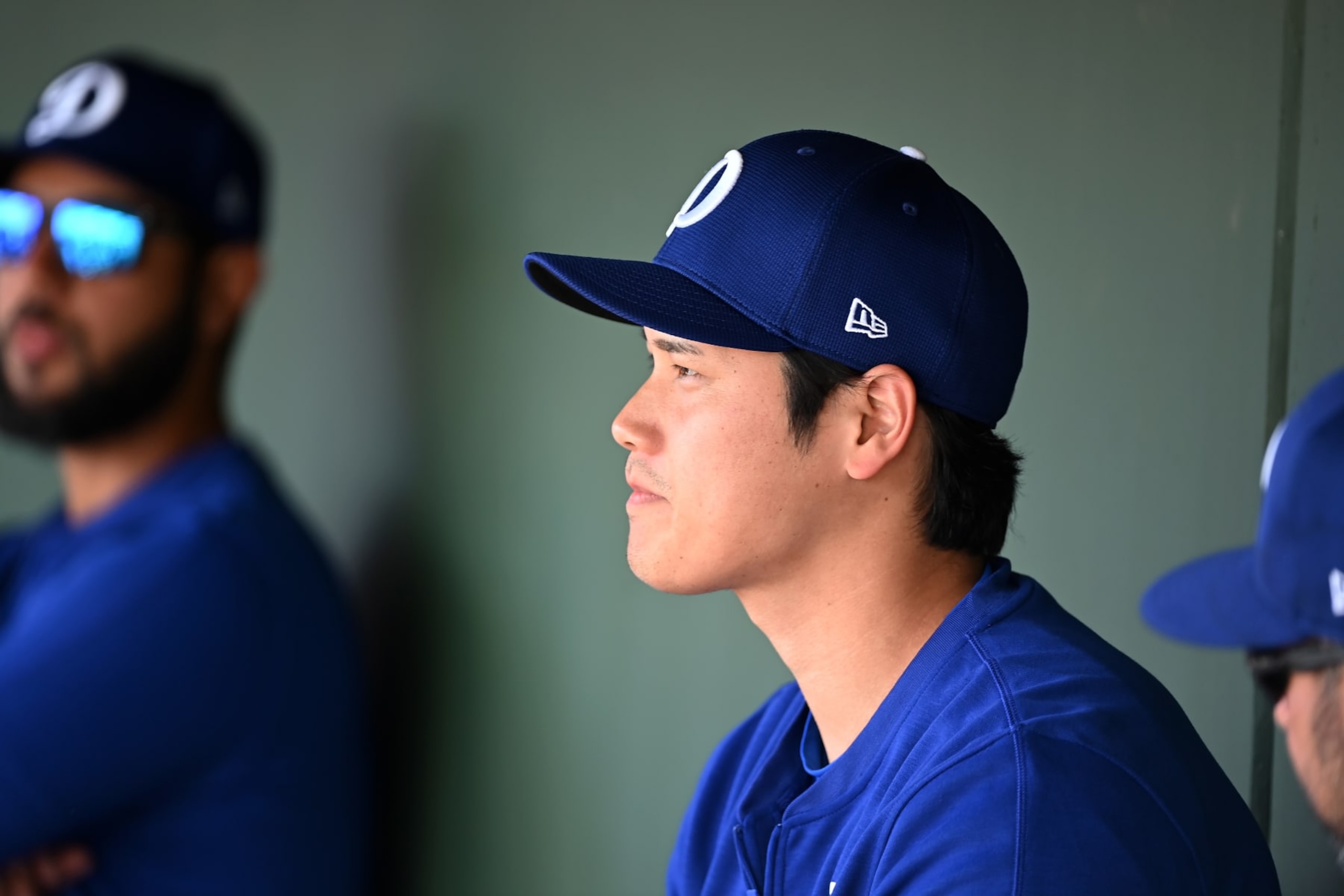 SURPRISE, ARIZONA - FEBRUARY 28: Shohei Ohtani #17 of the Los Angeles Dodgers looks on from the dugout against the Texas Rangers during a spring training game at Surprise Stadium on February 28, 2024 in Surprise, Arizona. (Photo by Norm Hall/Getty Images)
