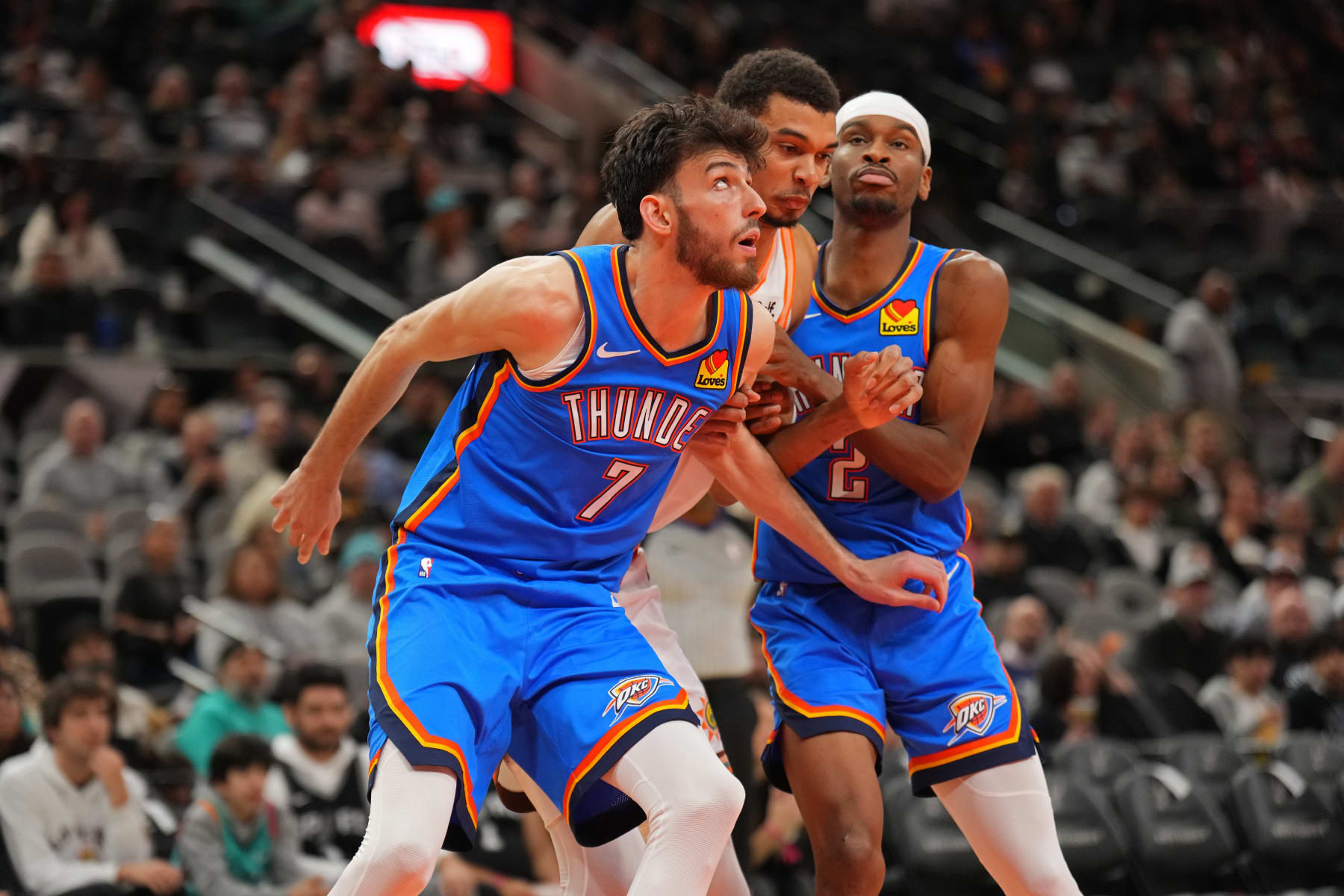SAN ANTONIO, TX - JANUARY 24: Chet Holmgren #7 of the Oklahoma City Thunder, Victor Wembanyama #1 of the San Antonio Spurs and Shai Gilgeous-Alexander #2 of the Oklahoma City Thunder wait for a rebound during the game on January 24, 2023 at the Frost Bank Center in San Antonio, Texas. NOTE TO USER: User expressly acknowledges and agrees that, by downloading and or using this photograph, user is consenting to the terms and conditions of the Getty Images License Agreement. Mandatory Copyright Notice: Copyright 2024 NBAE (Photos by Jesse D. Garrabrant/NBAE via Getty Images)