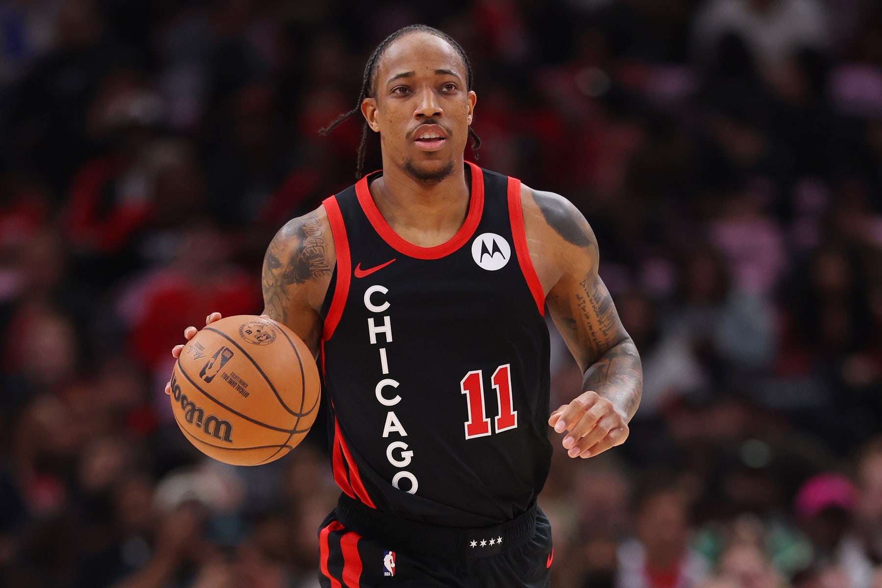 CHICAGO, ILLINOIS - FEBRUARY 27: DeMar DeRozan #11 of the Chicago Bulls dribbles up the court against the Detroit Pistons during the first half at the United Center on February 27, 2024 in Chicago, Illinois. NOTE TO USER: User expressly acknowledges and agrees that, by downloading and or using this photograph, User is consenting to the terms and conditions of the Getty Images License Agreement. (Photo by Michael Reaves/Getty Images)