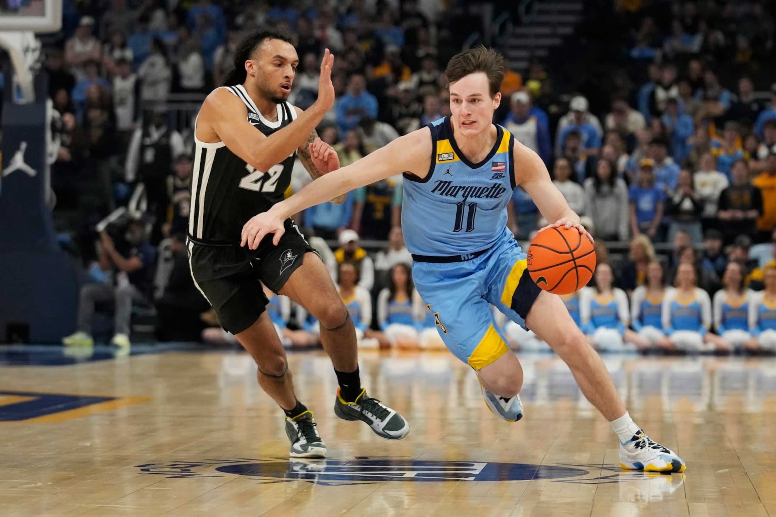 MILWAUKEE, WISCONSIN - FEBRUARY 28: Tyler Kolek #11 of the Marquette Golden Eagles dribbles the ball around Devin Carter #22 of the Providence Friars during the first half at Fiserv Forum on February 28, 2024 in Milwaukee, Wisconsin. (Photo by Patrick McDermott/Getty Images) MILWAUKEE, WISCONSIN - FEBRUARY 28: Tyler Kolek #11 of the Marquette Golden Eagles dribbles the ball around Devin Carter #22 of the Providence Friars during the first half at Fiserv Forum on February 28, 2024 in Milwaukee, Wisconsin. (Photo by Patrick McDermott/Getty Images)