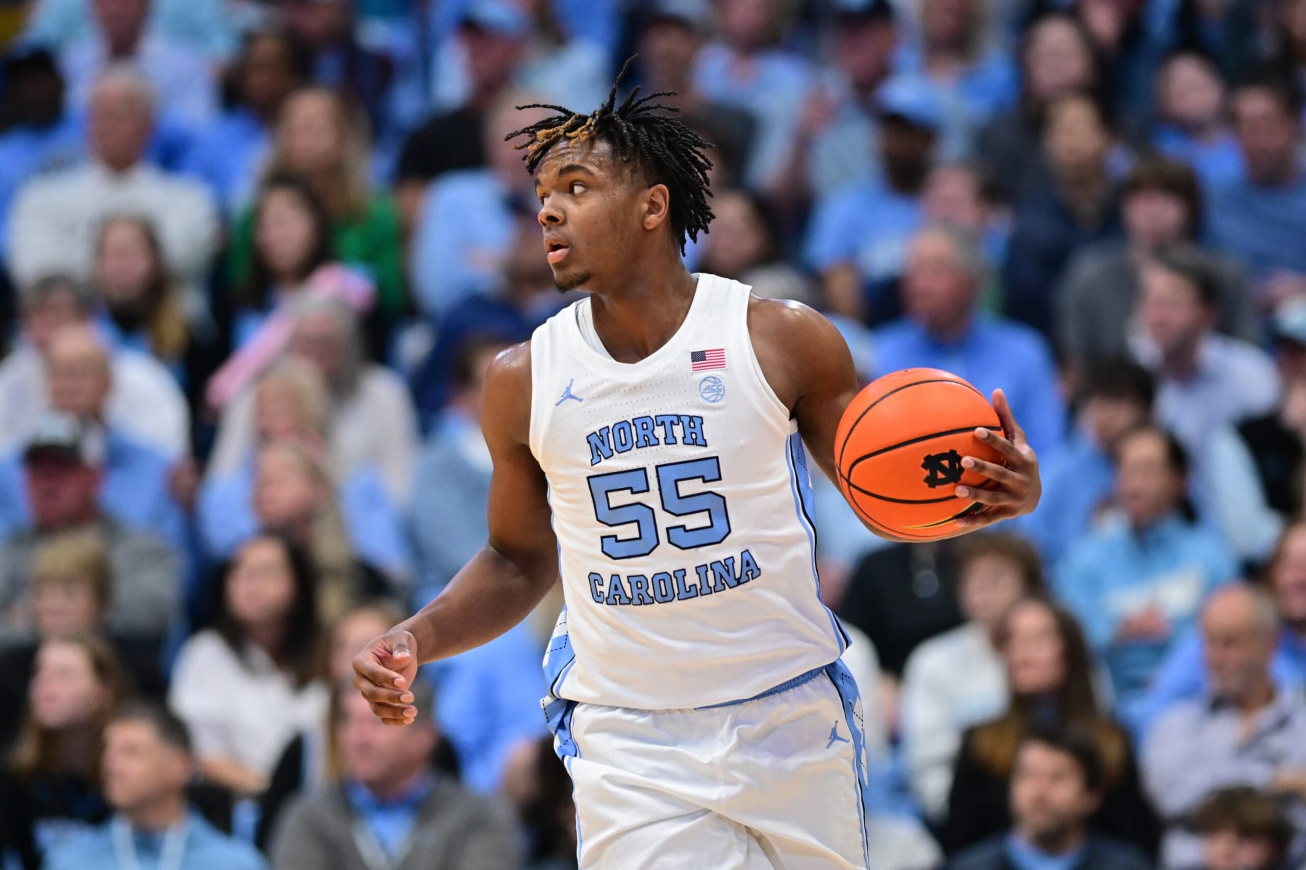 CHAPEL HILL, NORTH CAROLINA - FEBRUARY 26: Harrison Ingram #55 of the North Carolina Tar Heels moves the ball against the Miami Hurricanes during the game at the Dean E. Smith Center on February 26, 2024 in Chapel Hill, North Carolina. (Photo by Grant Halverson/Getty Images)