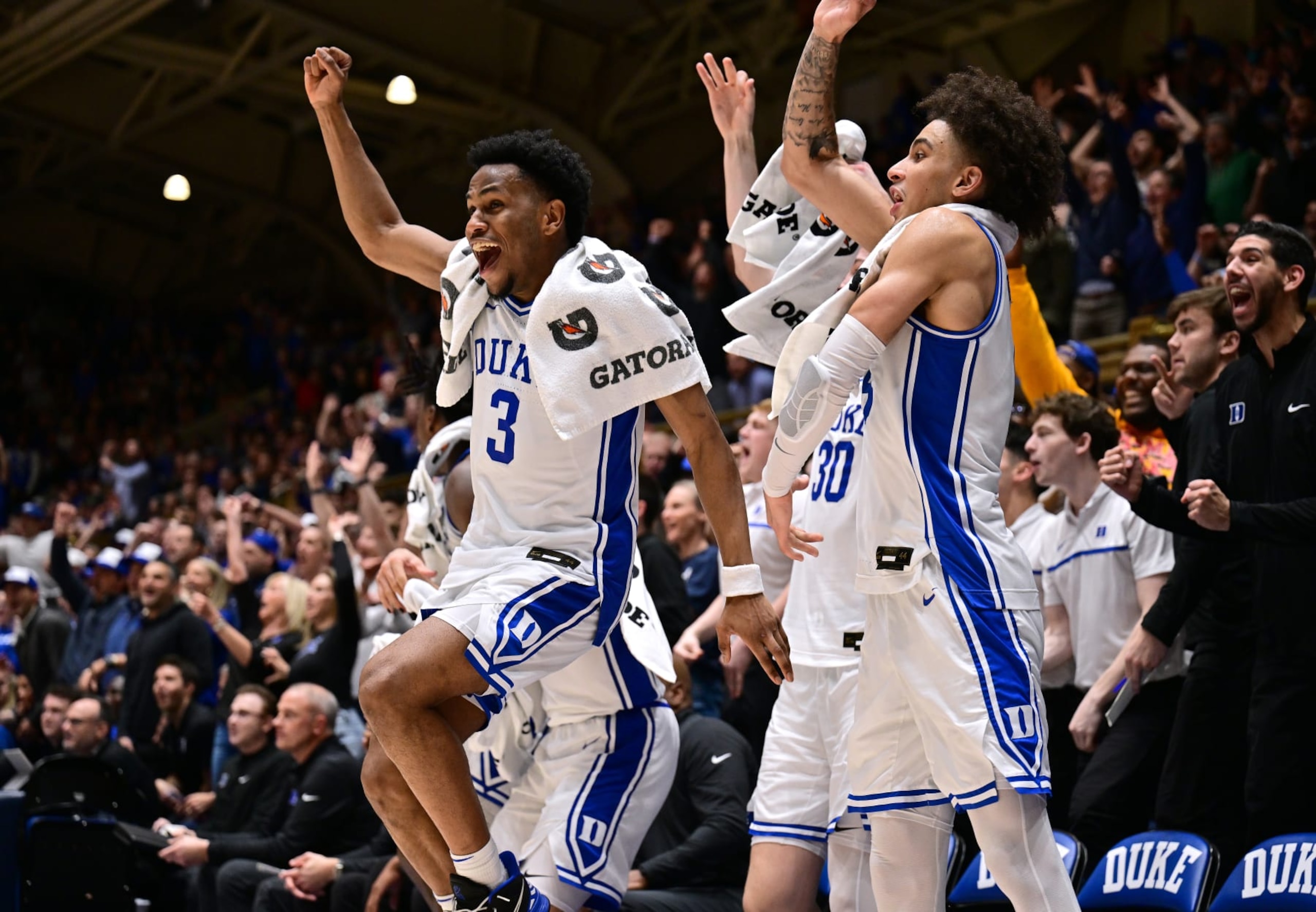 DURHAM, NORTH CAROLINA - FEBRUARY 28: The Duke Blue Devils bench cheers on the reserves during the final minute of the second half of the game against the Louisville Cardinals at Cameron Indoor Stadium on February 28, 2024 in Durham, North Carolina. (Photo by Grant Halverson/Getty Images)
