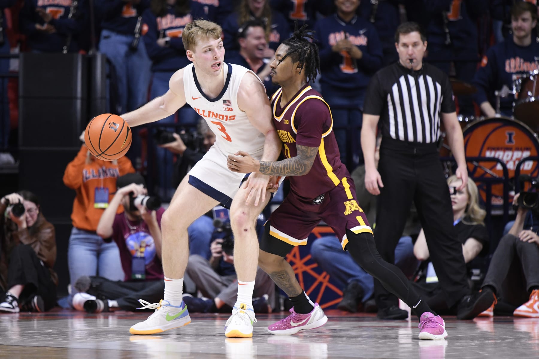 CHAMPAIGN, IL - FEBRUARY 28: Illinois Fighting Illini Guard Marcus Domask (3) works the ball inside against Minnesota Golden Gophers Guard Elijah Hawkins (0) during the college basketball game between the Minnesota Golden Gophers and the Illinois Fighting Illini on February 28, 2024, at the State Farm Center in Champaign, Illinois. (Photo by Michael Allio/Icon Sportswire via Getty Images)
