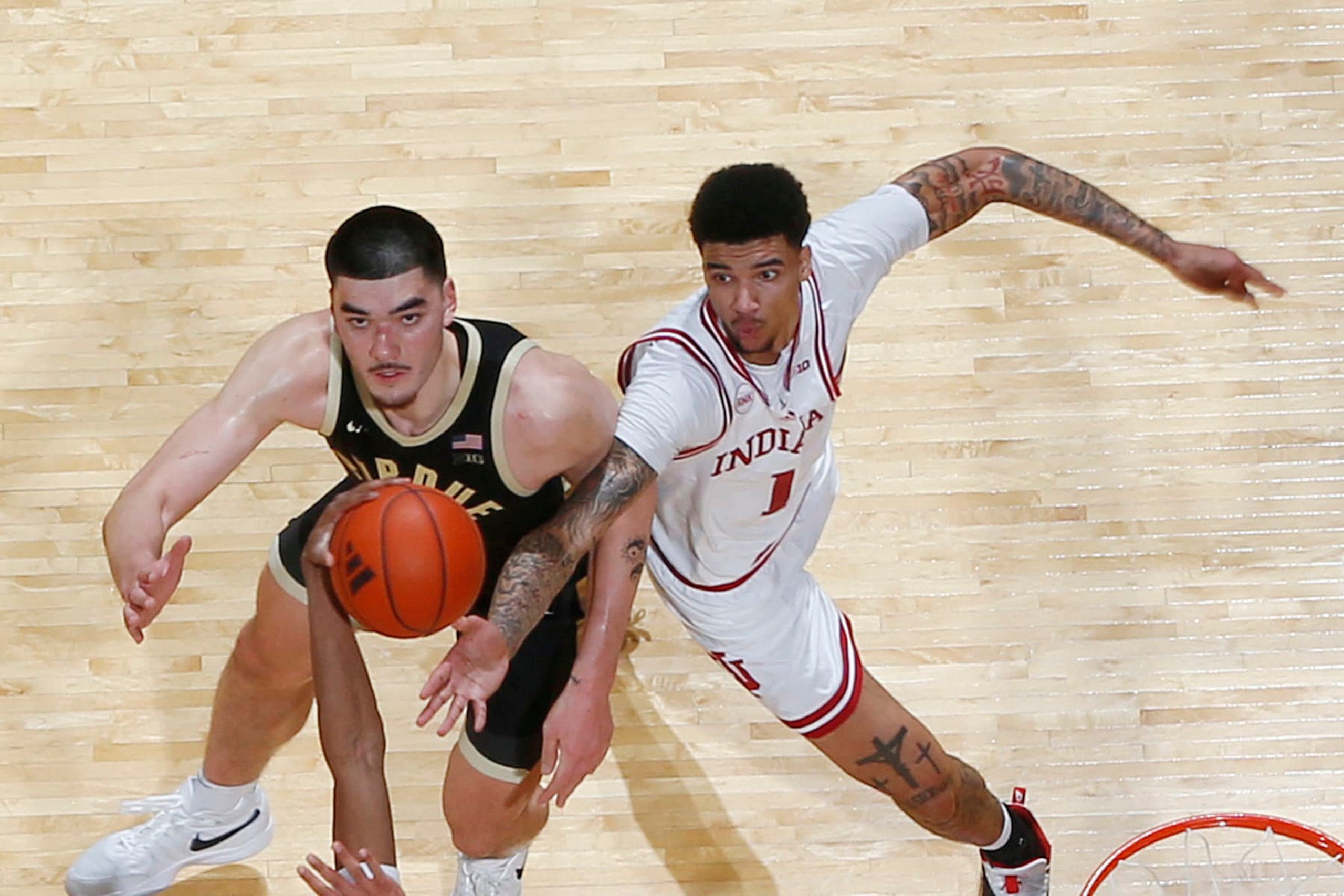 BLOOMINGTON, IN - JANUARY 16: Purdue Boilermakers center Zach Edey (15) battles for rebounding position against Indiana Hoosiers center Kel'el Ware (1) on January 16, 2024, at Simon Skjodt Assembly Hall in Bloomington, Indiana. (Photo by Brian Spurlock/Icon Sportswire via Getty Images)