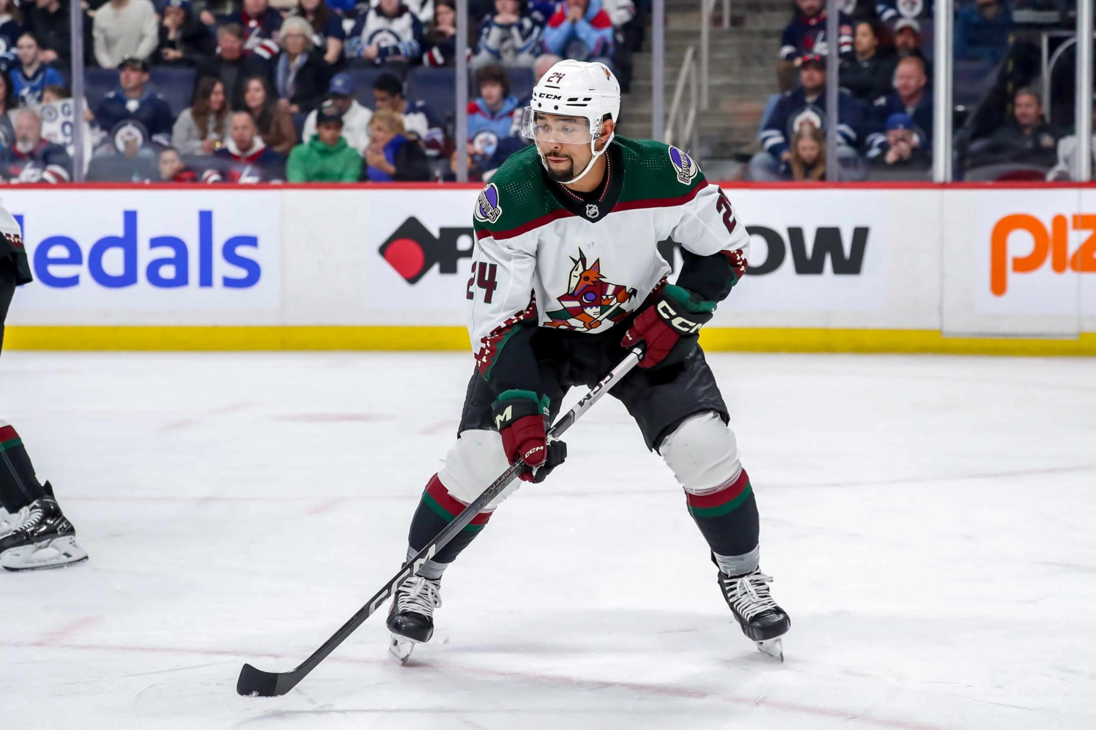 WINNIPEG, CANADA - FEBRUARY 25: Matt Dumba #24 of the Arizona Coyotes gets set during a first period face-off against the Winnipeg Jets at the Canada Life Centre on February 25, 2024 in Winnipeg, Manitoba, Canada. The Jets defeated the Coyotes 4-3 in overtime. (Photo by Darcy Finley/NHLI via Getty Images) WINNIPEG, CANADA - FEBRUARY 25: Matt Dumba #24 of the Arizona Coyotes gets set during a first period face-off against the Winnipeg Jets at the Canada Life Centre on February 25, 2024 in Winnipeg, Manitoba, Canada. The Jets defeated the Coyotes 4-3 in overtime. (Photo by Darcy Finley/NHLI via Getty Images)