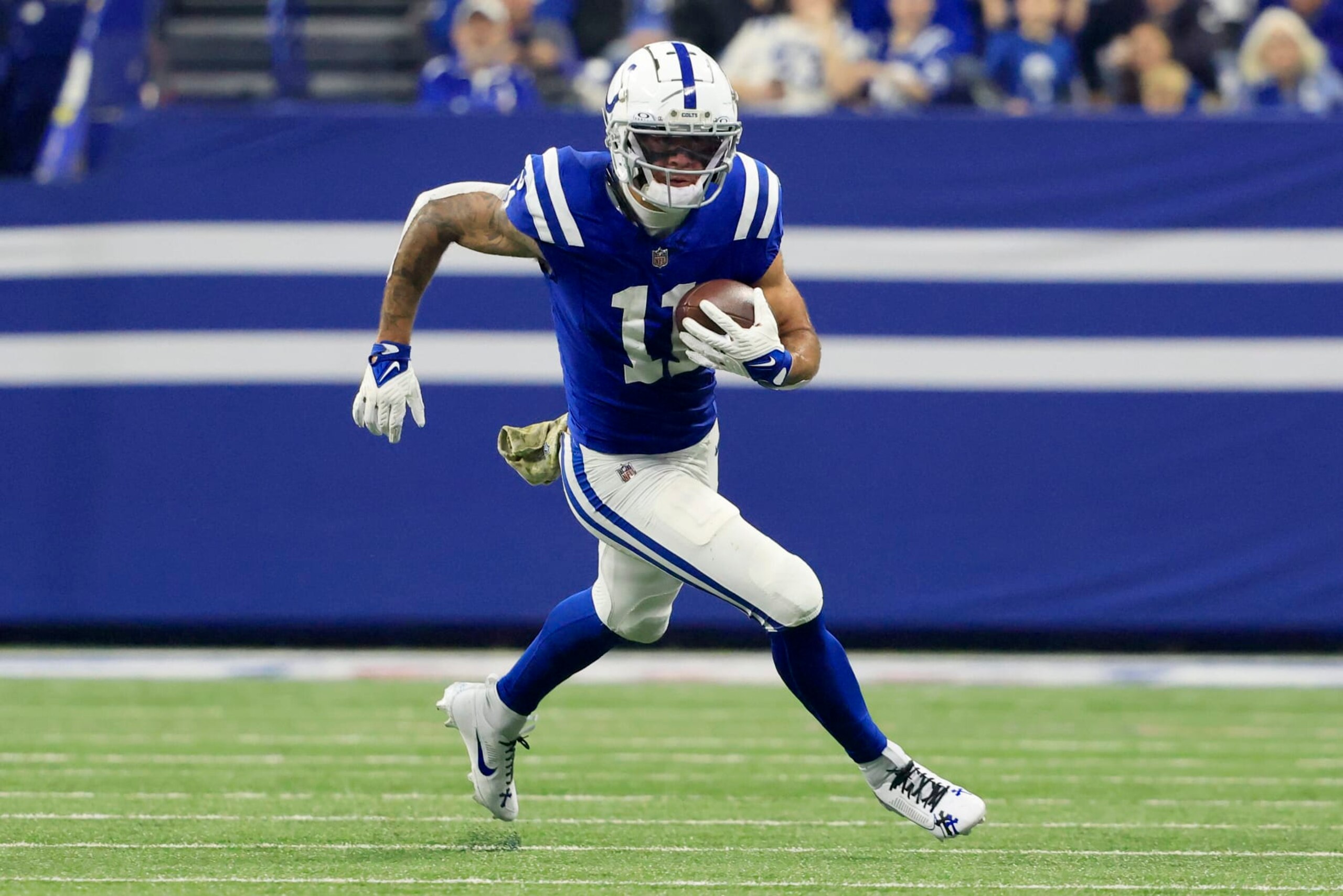 INDIANAPOLIS, INDIANA - NOVEMBER 26: Michael Pittman Jr. #11 of the Indianapolis Colts runs the ball after a catch in the game against the Tampa Bay Buccaneers at Lucas Oil Stadium on November 26, 2023 in Indianapolis, Indiana. (Photo by Justin Casterline/Getty Images)
