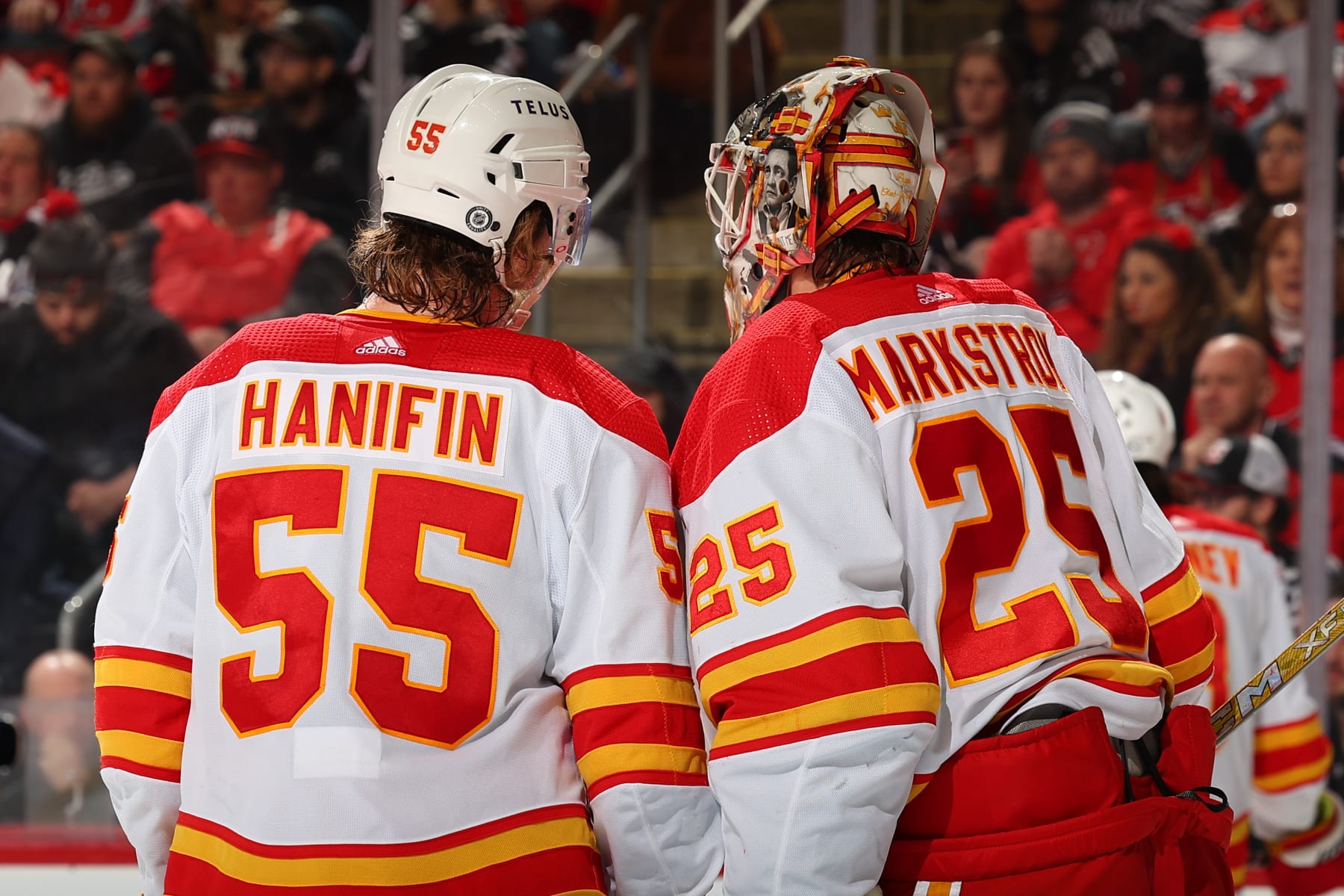 NEWARK, NJ - FEBRUARY 08:  Noah Hanifin #55 of the Calgary Flames and Jacob Markstrom #25 during the third period of the game against the New Jersey Devils at the Prudential Center on February 8, 2024 in Newark, New Jersey.  (Photo by Rich Graessle/NHLI via Getty Images)
