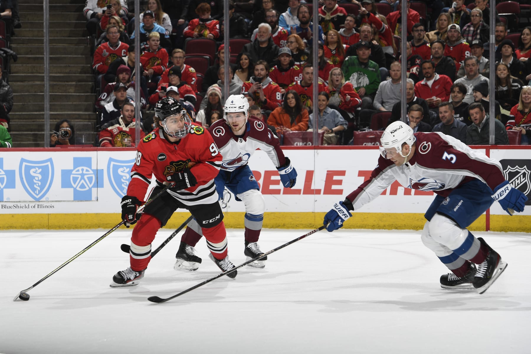 CHICAGO, ILLINOIS - FEBRUARY 29: Connor Bedard #98 of the Chicago Blackhawks looks to shoot the puck against Jack Johnson #3 of the Colorado Avalanche in the first period at the United Center on February 29, 2024 in Chicago, Illinois. (Photo by Bill Smith/NHLI via Getty Images)