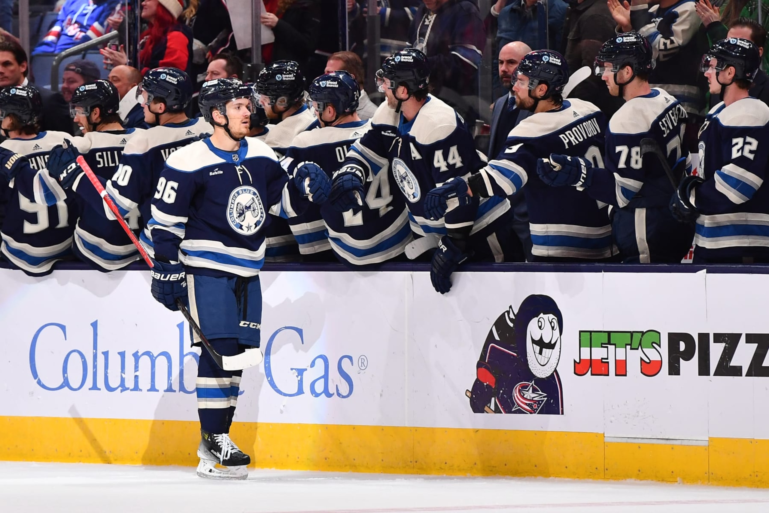 COLUMBUS, OHIO - FEBRUARY 25: Jack Roslovic #96 of the Columbus Blue Jackets high-fives his teammates after scoring a goal during the second period of a game against the New York Rangers at Nationwide Arena on February 25, 2024 in Columbus, Ohio. (Photo by Ben Jackson/NHLI via Getty Images)