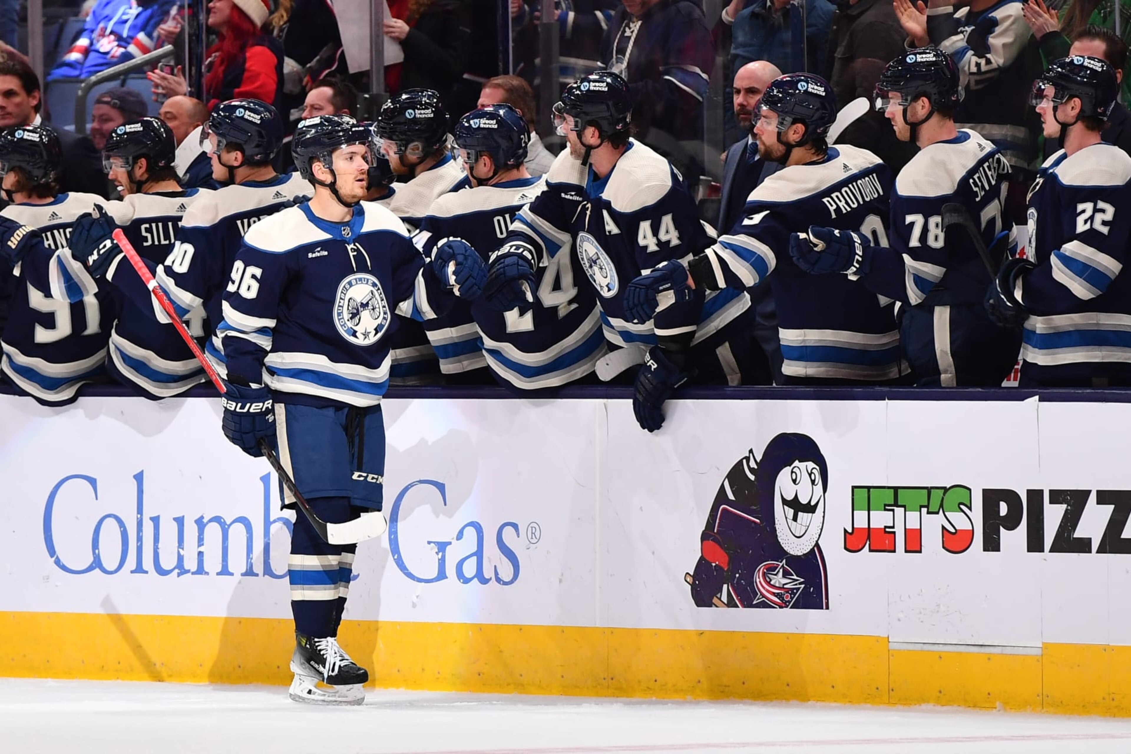 COLUMBUS, OHIO - FEBRUARY 25: Jack Roslovic #96 of the Columbus Blue Jackets high-fives his teammates after scoring a goal during the second period of a game against the New York Rangers at Nationwide Arena on February 25, 2024 in Columbus, Ohio. (Photo by Ben Jackson/NHLI via Getty Images)