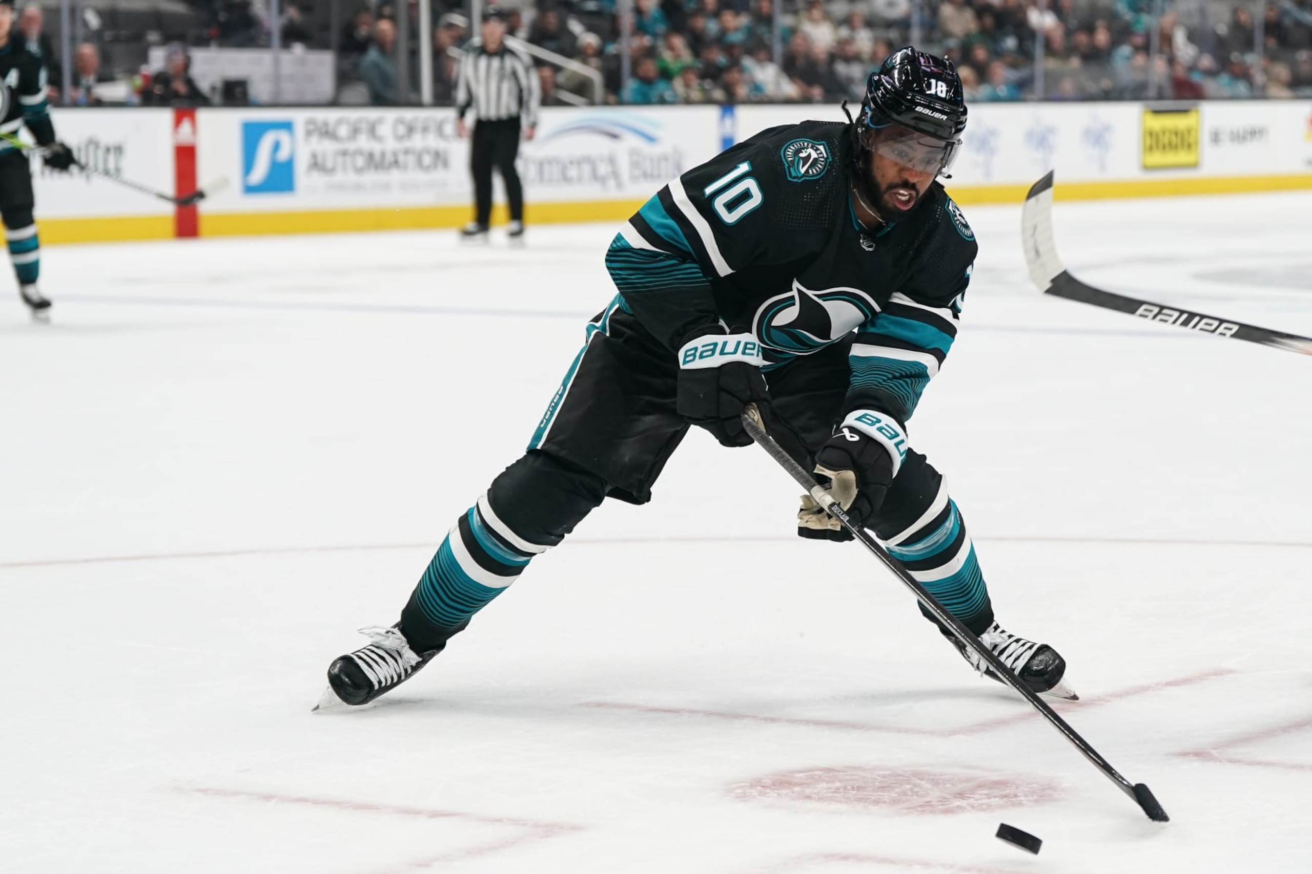 SAN JOSE, CA - FEBRUARY 29: Anthony Duclair #10 of the San Jose Sharks skates with the puck against the Anaheim Ducks in the third period at SAP Center on February 29, 2024 in San Jose, California. (Photo by Kavin Mistry/NHLI via Getty Images)