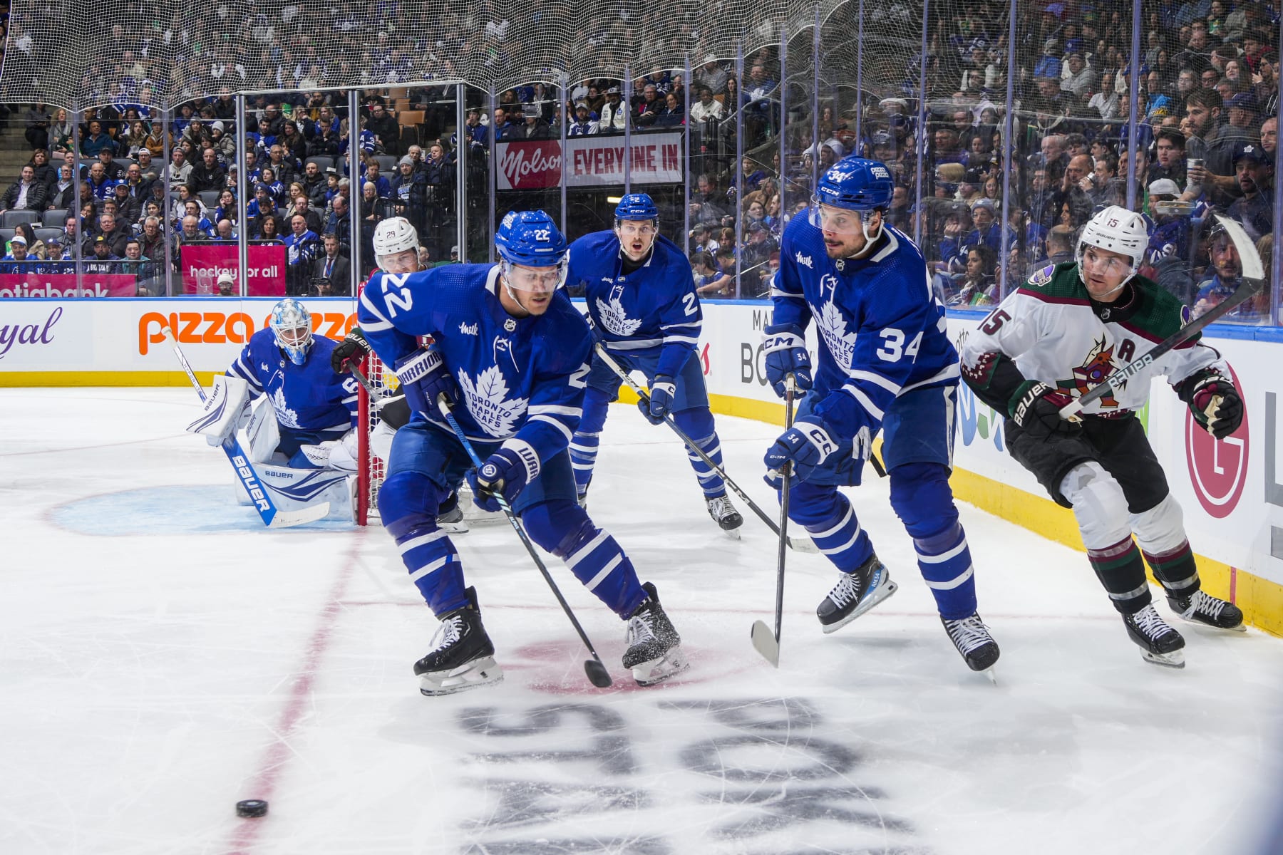 TORONTO, ON - FEBRUARY 29: Auston Matthews #34 of the Toronto Maple Leafs clears the puck against Alex Kerfoot #15 of the Arizona Coyotes during the second period at Scotiabank Arena on February 29, 2024 in Toronto, Ontario, Canada. (Photo by Mark Blinch/NHLI via Getty Images)