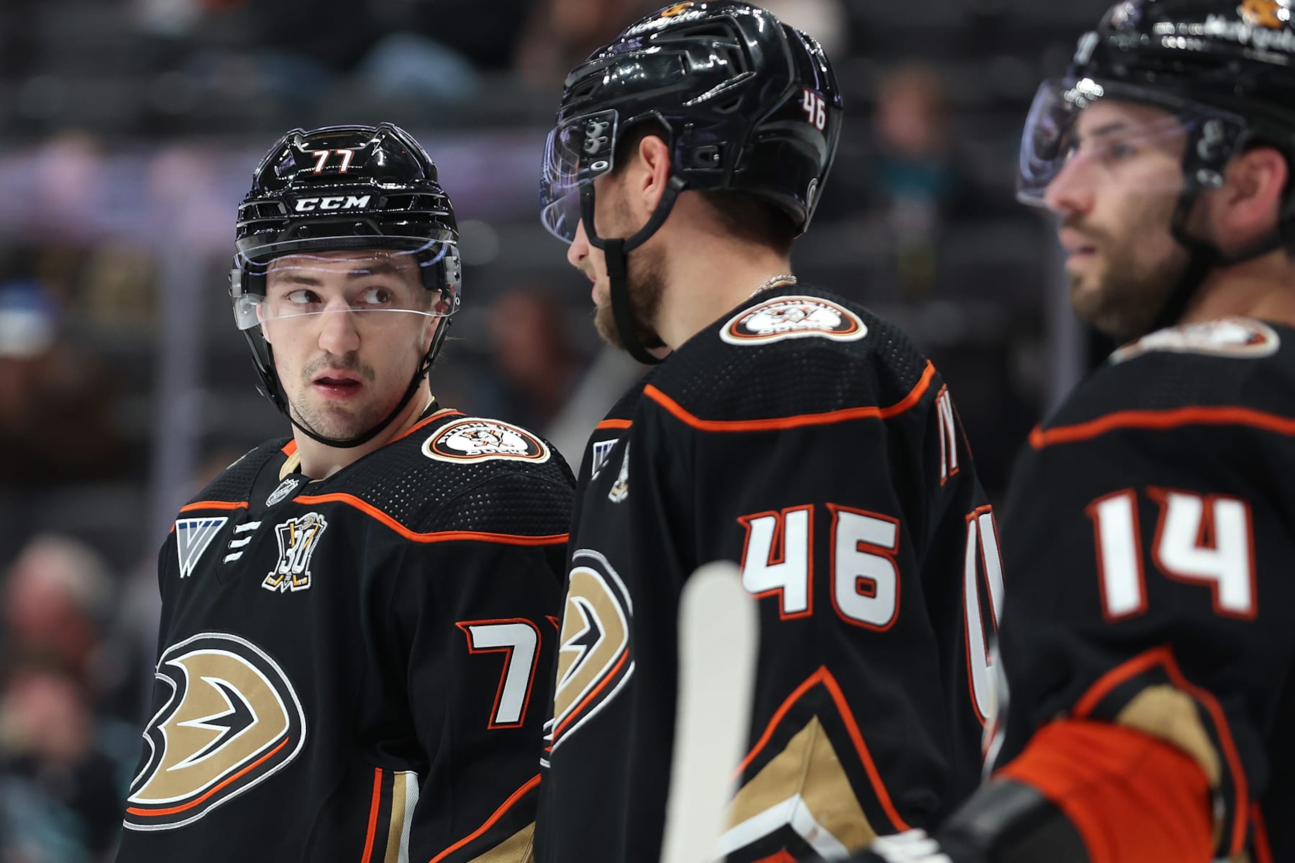 ANAHEIM, CALIFORNIA - JANUARY 05: Frank Vatrano #77, Ilya Lyubushkin #46, and Adam Henrique #14 of the Anaheim Ducks look on during the third period of a game against the Winnipeg Jets at Honda Center on January 05, 2024 in Anaheim, California. (Photo by Sean M. Haffey/Getty Images)